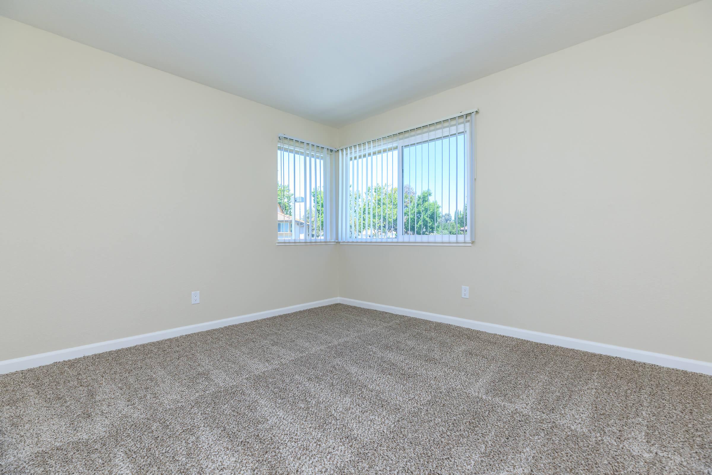 a bedroom with a large window