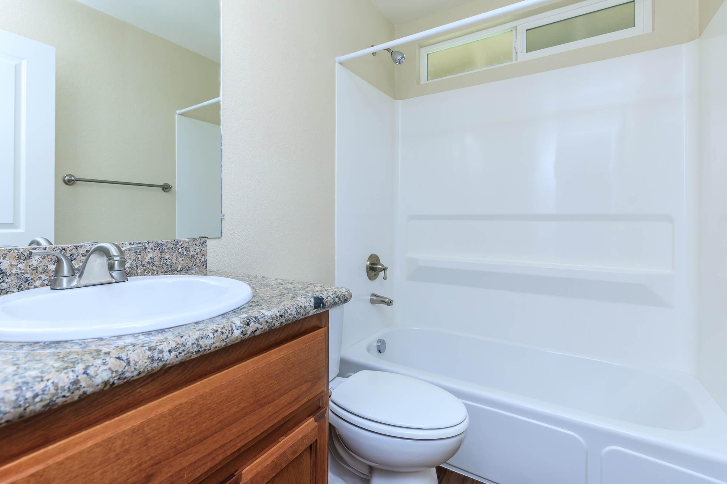 a close up of a sink and a bath tub