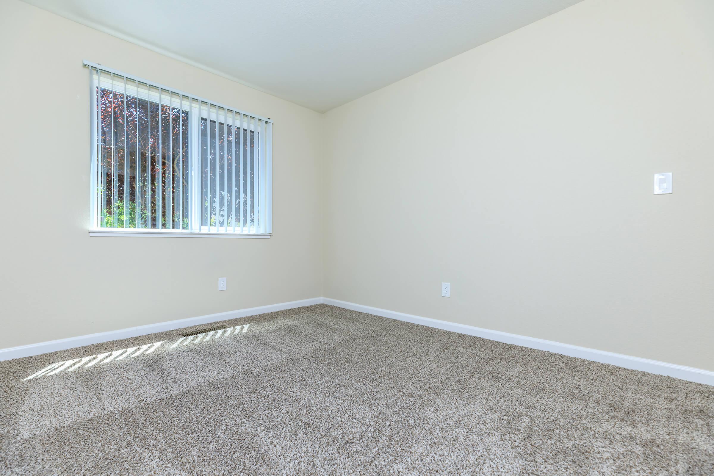 a bedroom with a large window