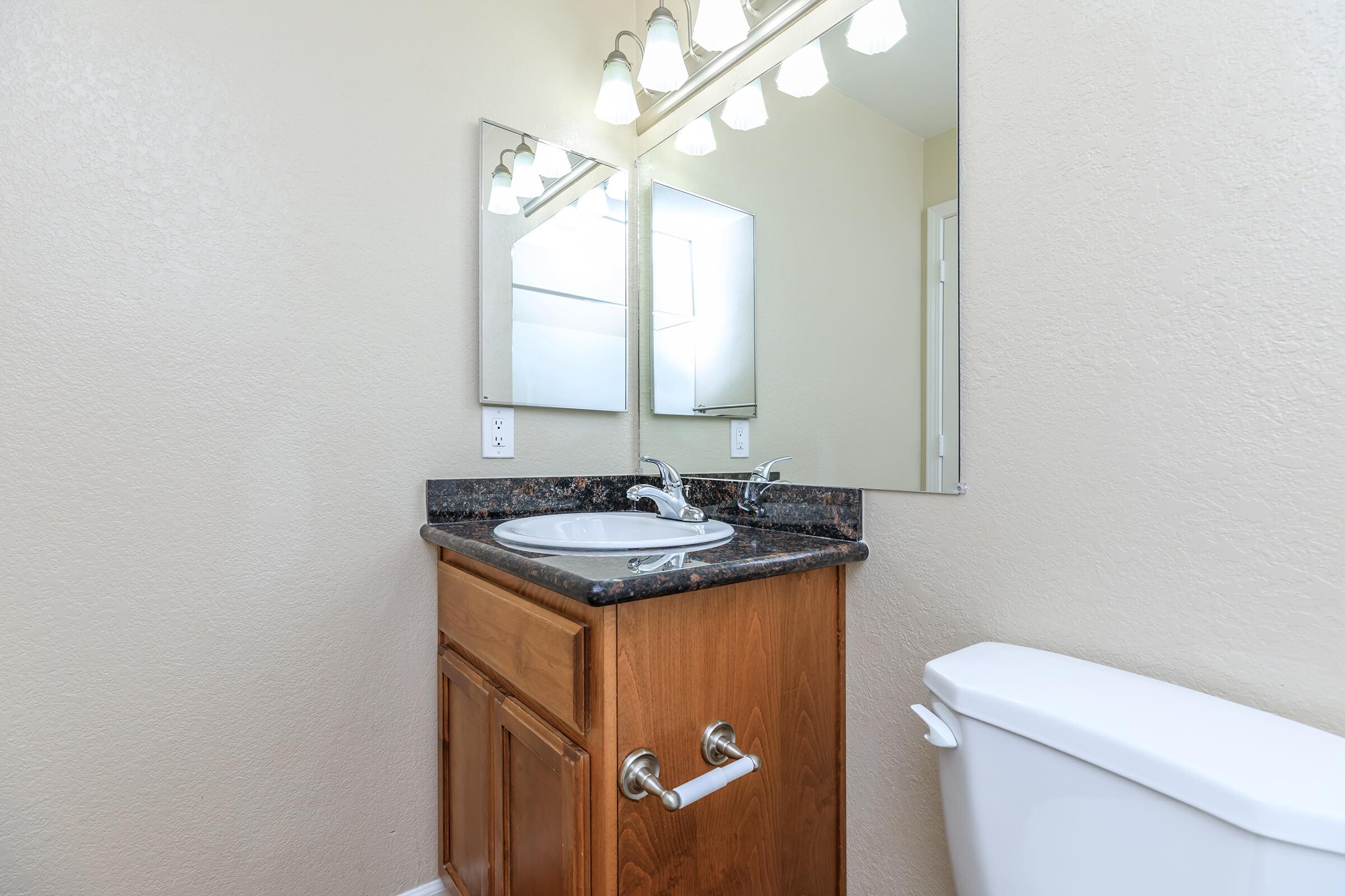 a close up of a sink and a mirror