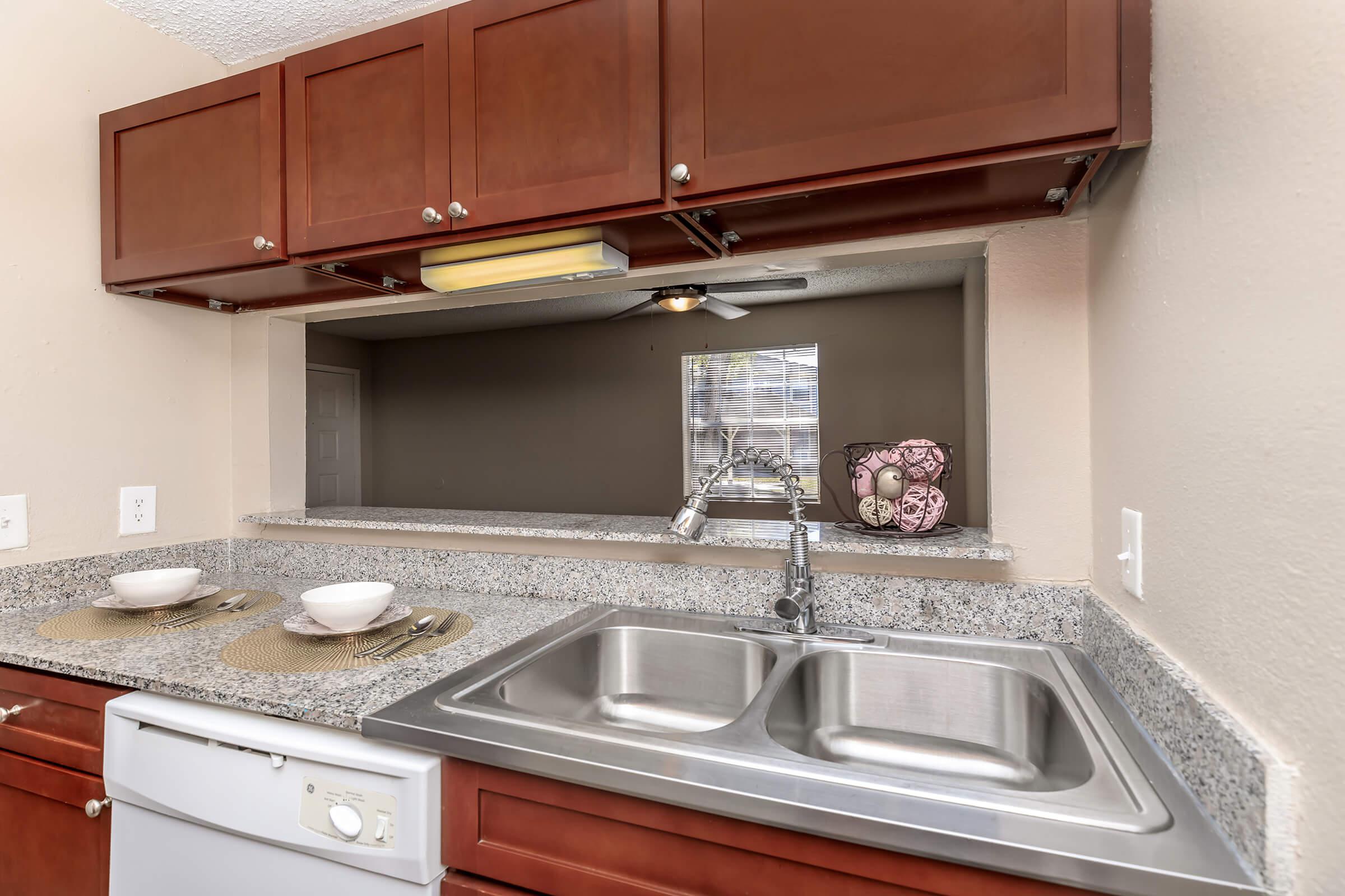 a kitchen with a sink and a microwave