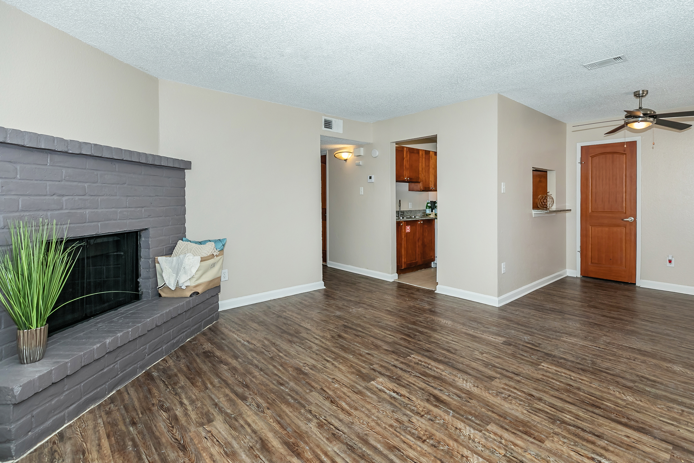 a room filled with furniture and a wood floor