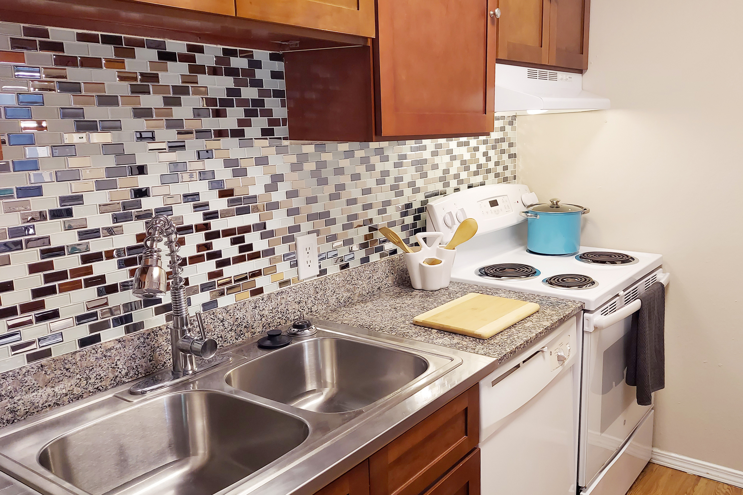 a kitchen with a stove and a sink