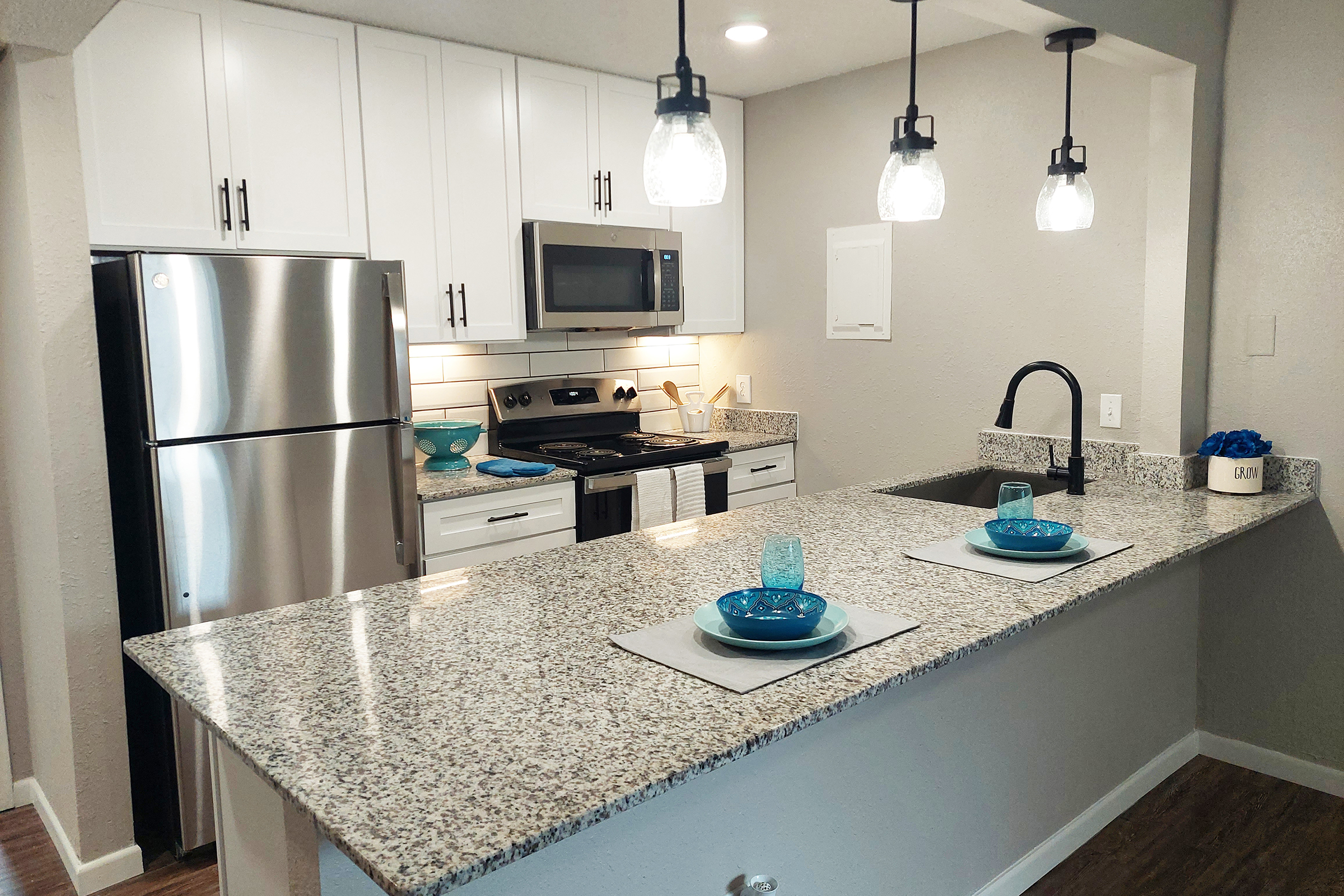 a modern kitchen with stainless steel appliances