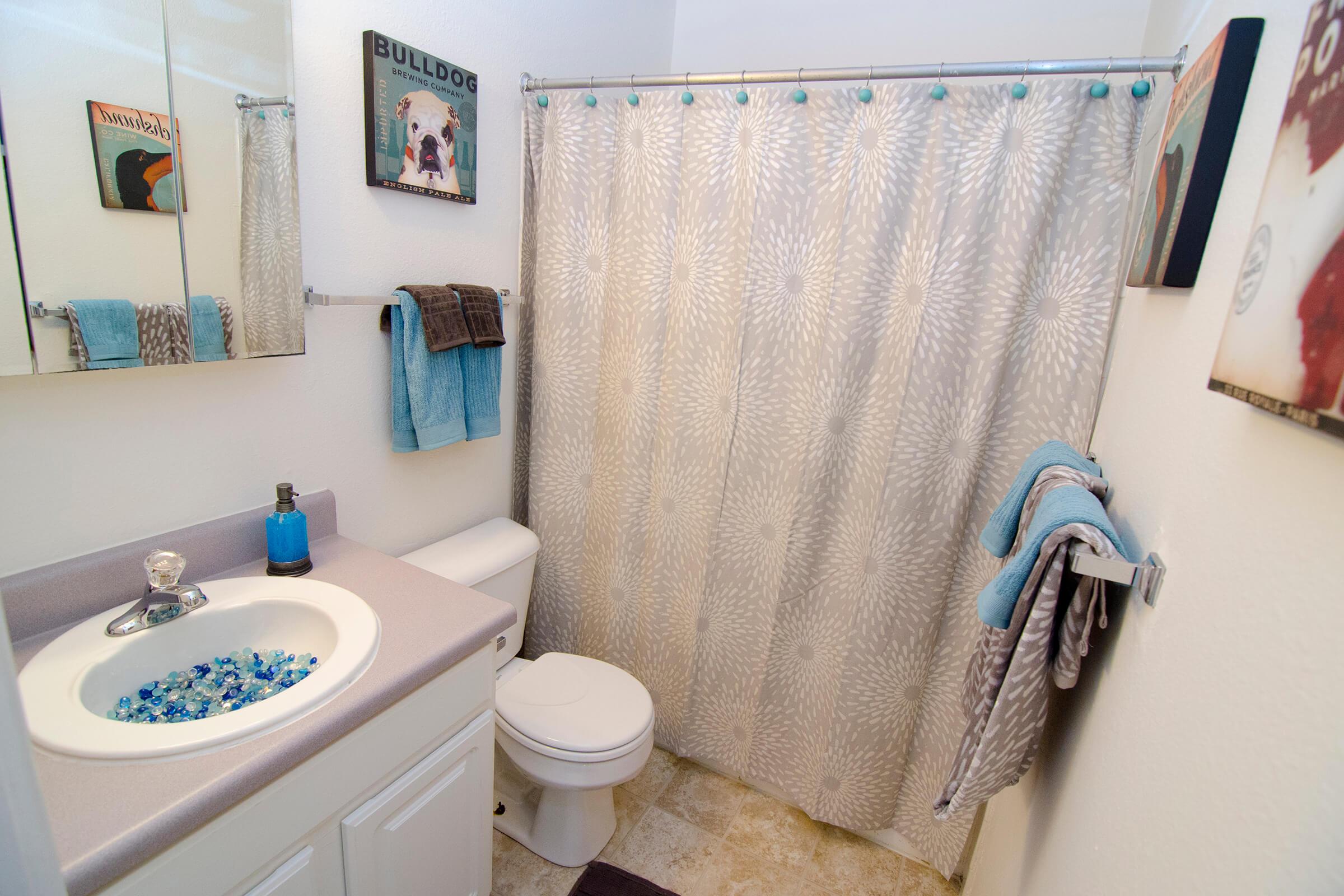 a white tub sitting next to a sink