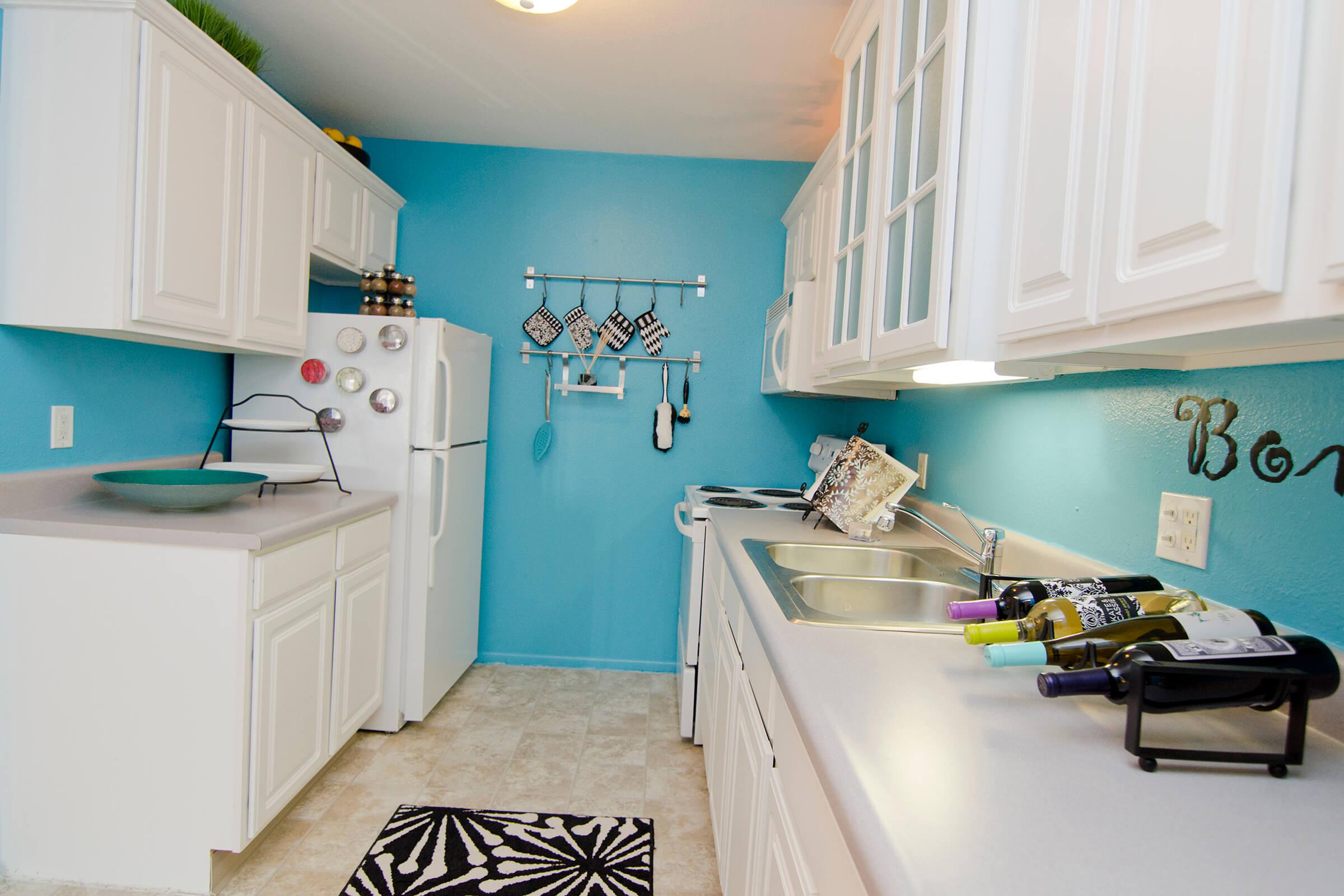 a kitchen with a stove and a sink