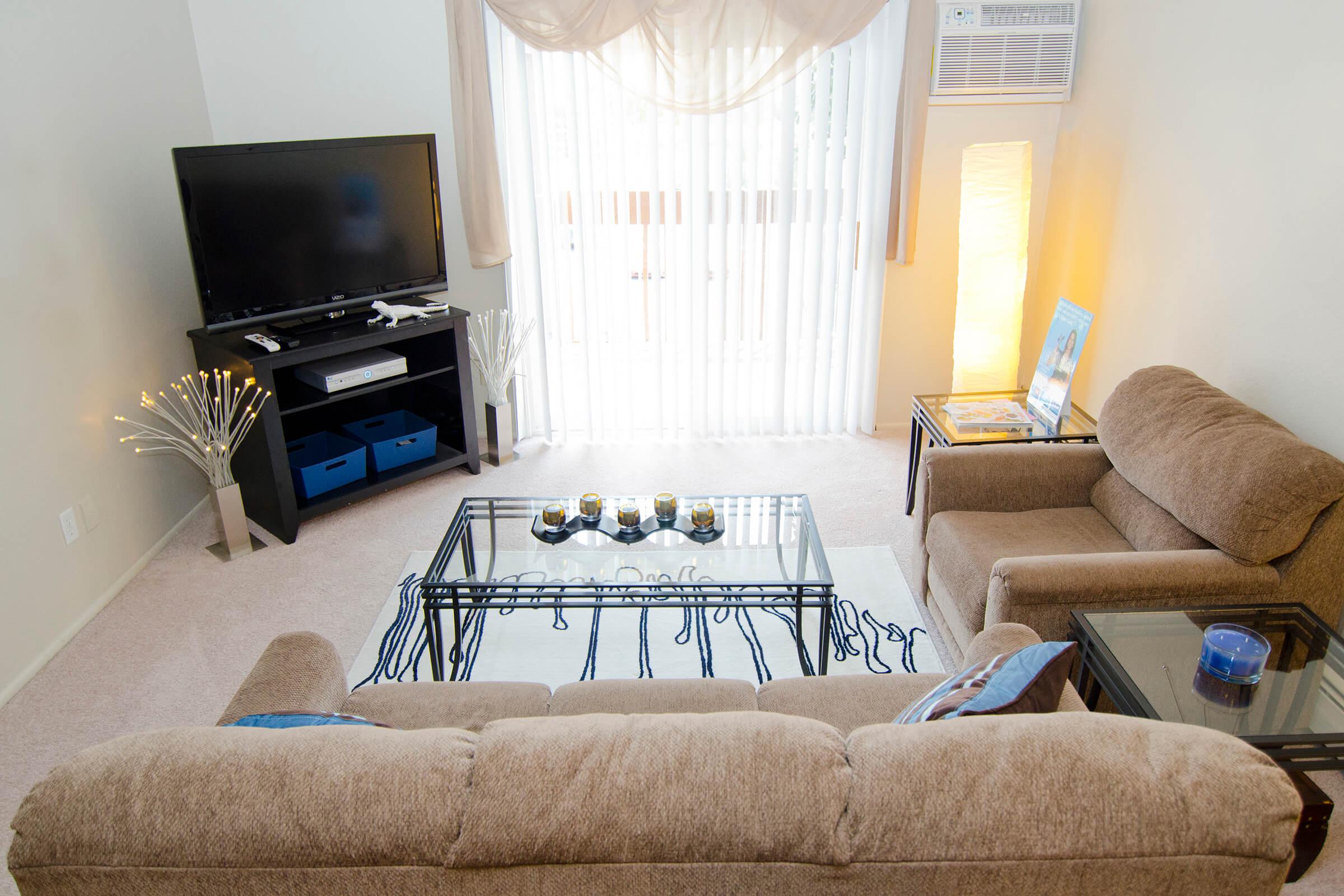 a bedroom with a view of a living room