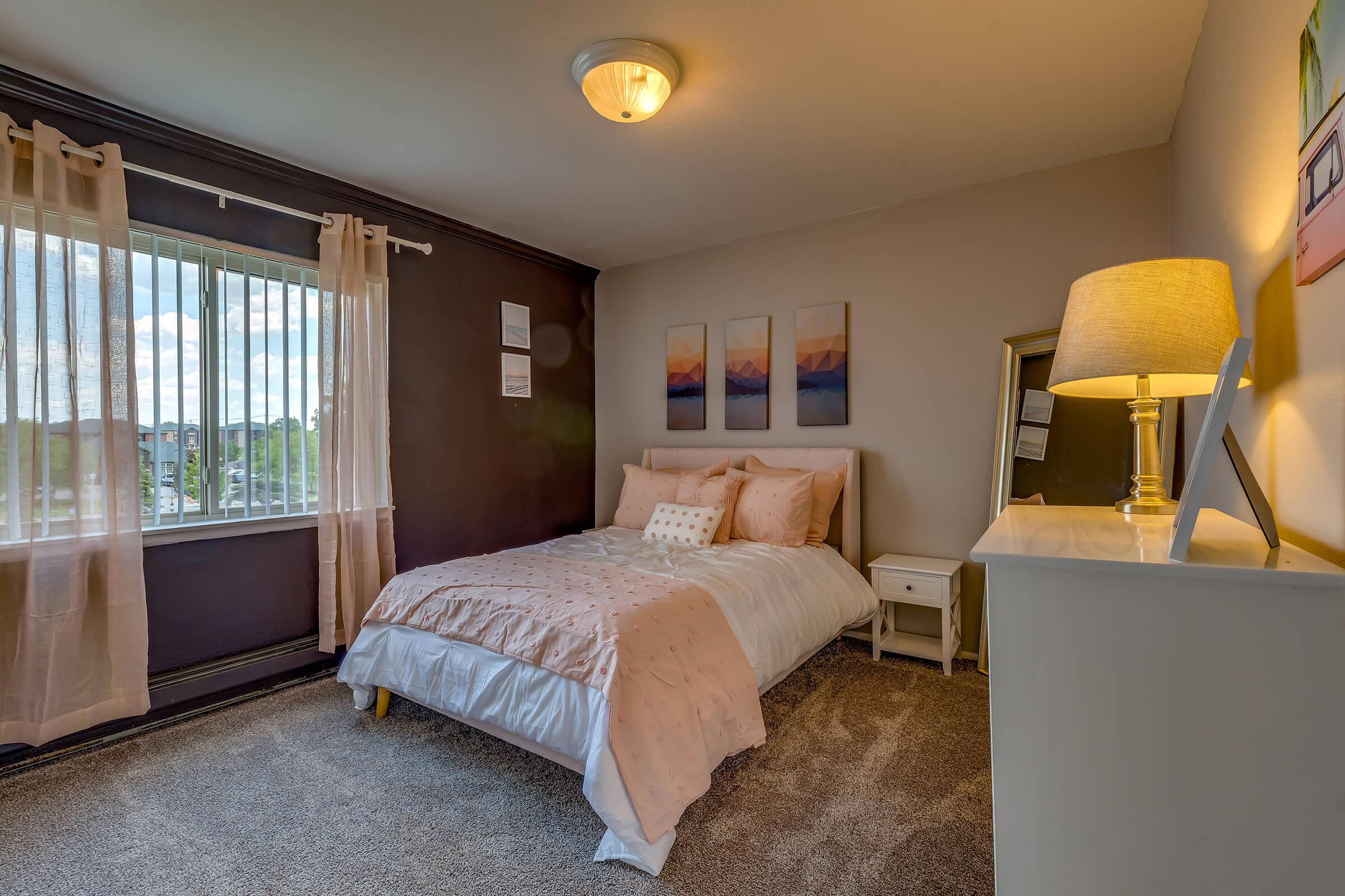 a bedroom with a large bed in a hotel room