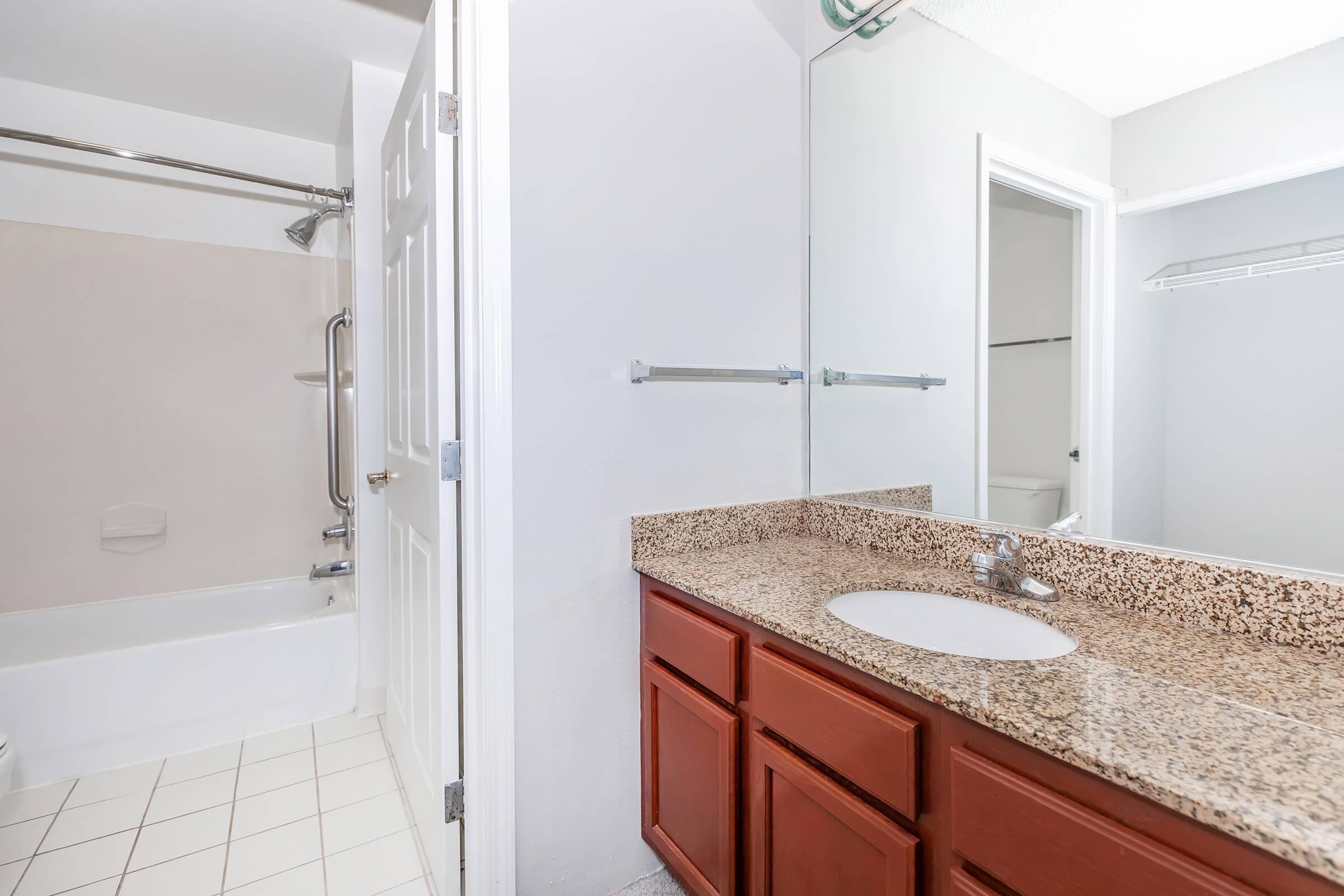 a room with a sink and a shower