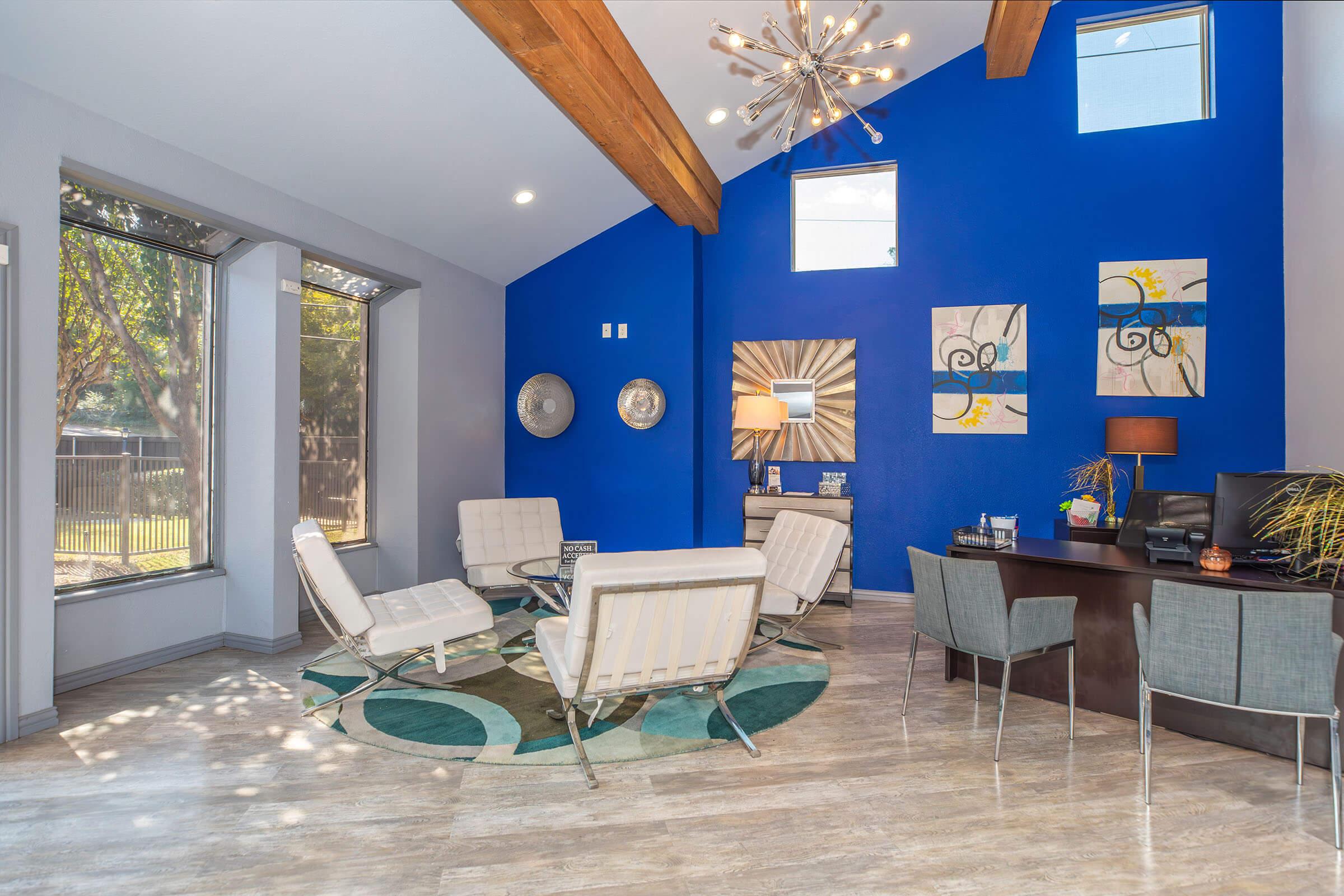 a living room with a blue chair