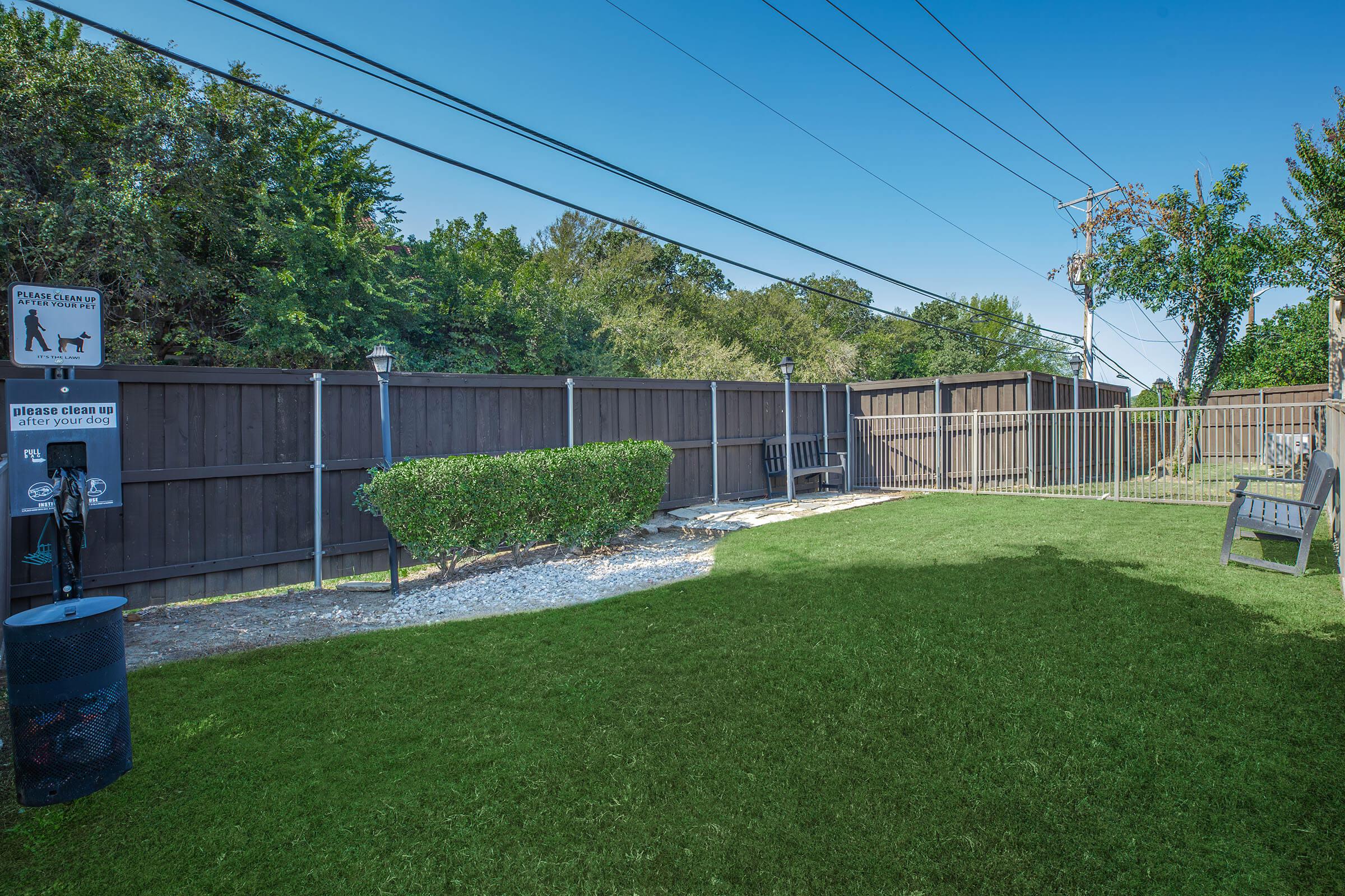 a yard with grass and trees