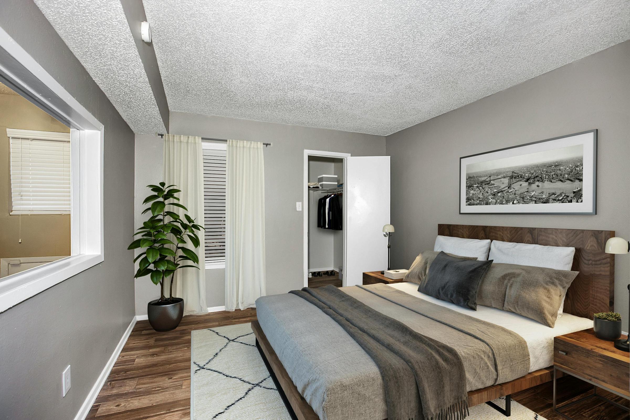 a bedroom with a large bed in a hotel room