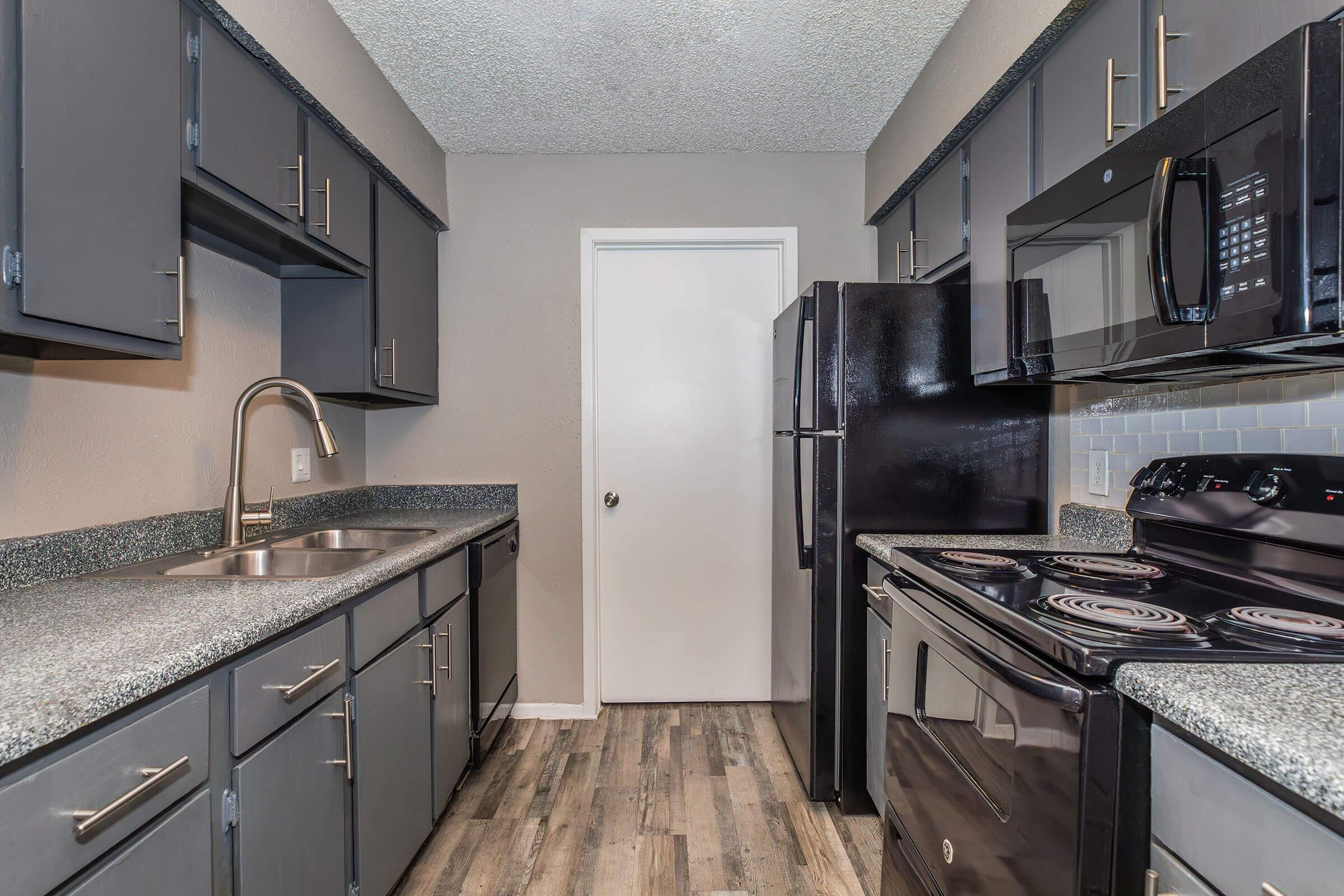 a modern kitchen with stainless steel appliances