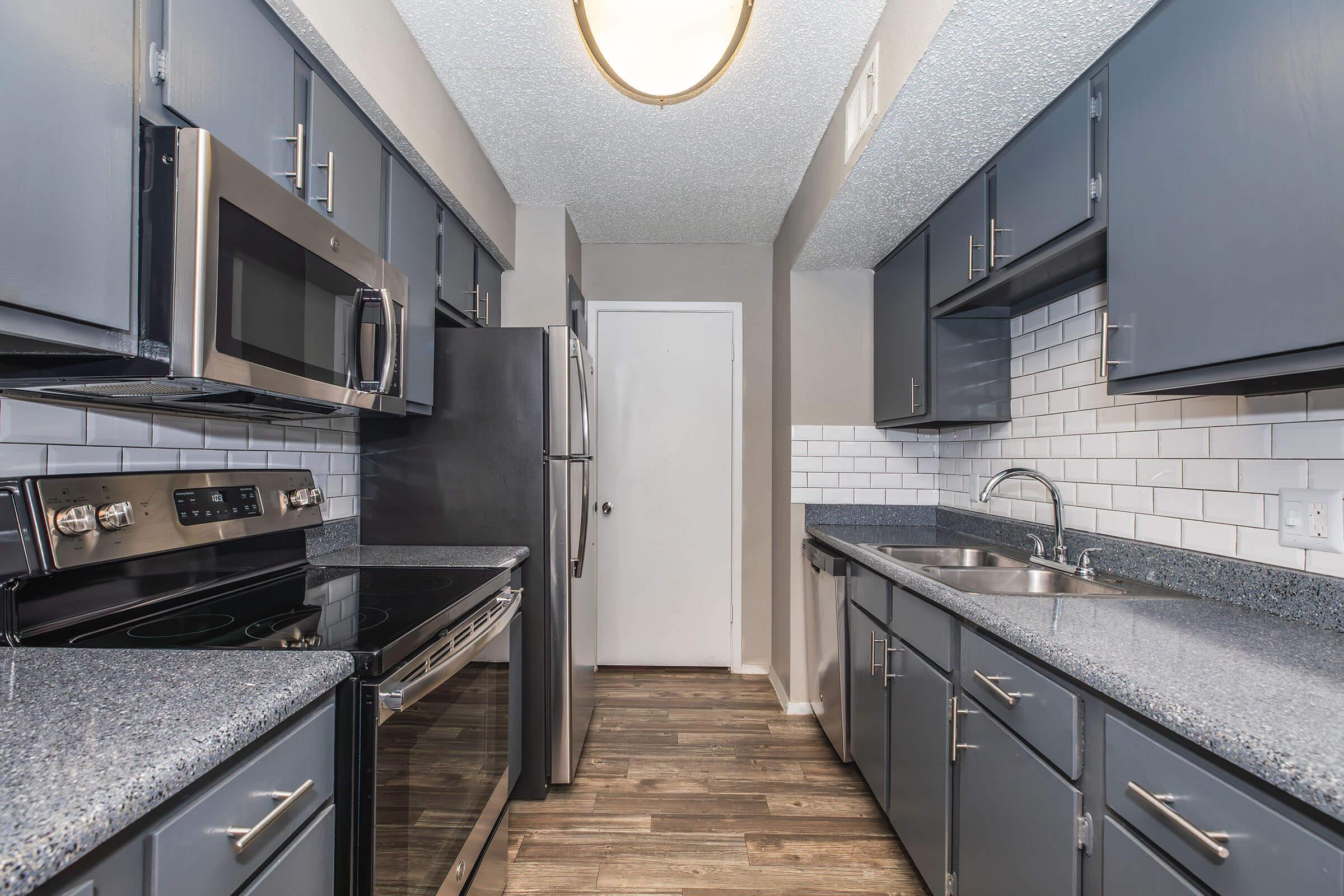 a modern kitchen with stainless steel appliances