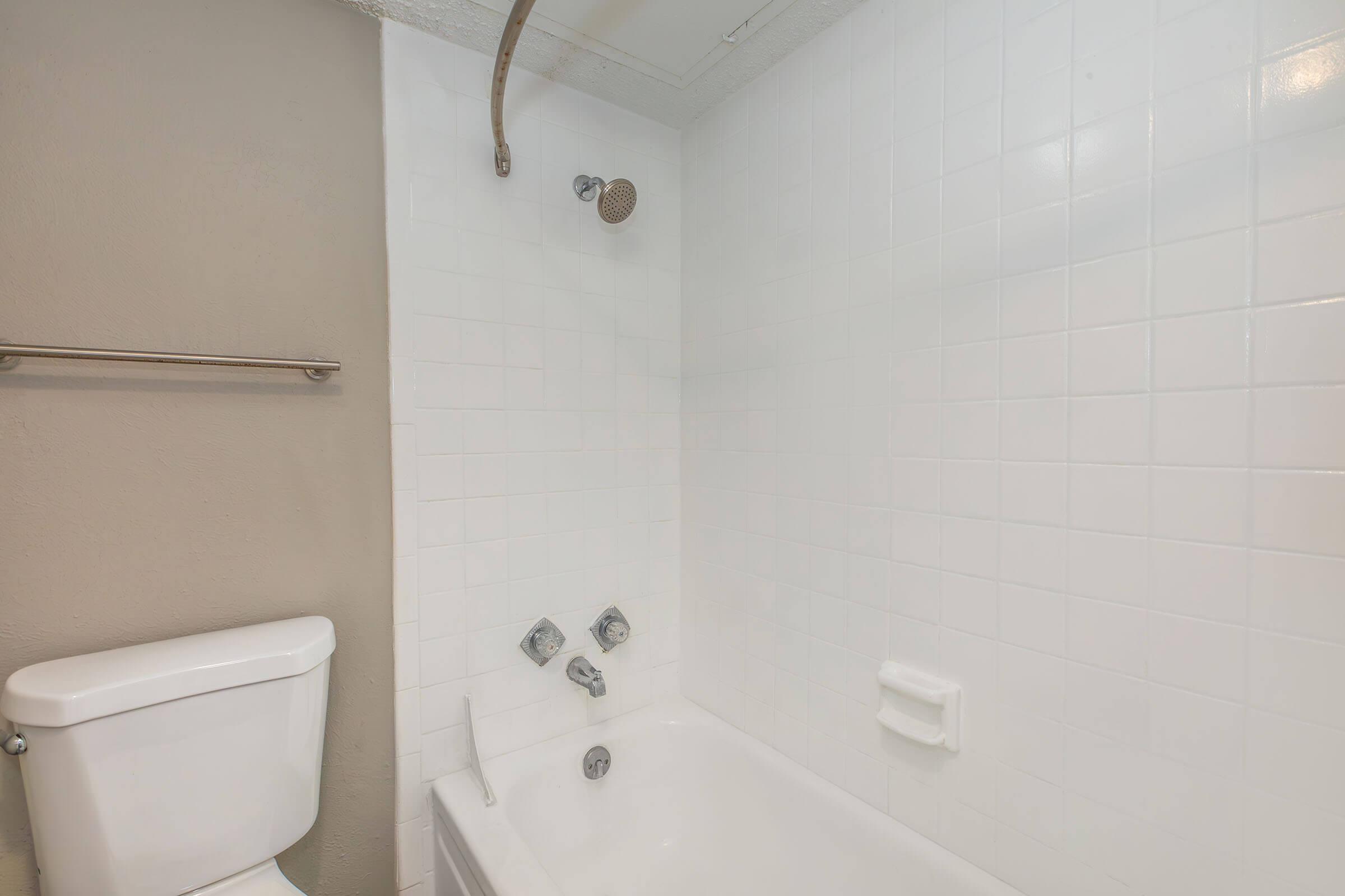 a rest room with a sink and a mirror