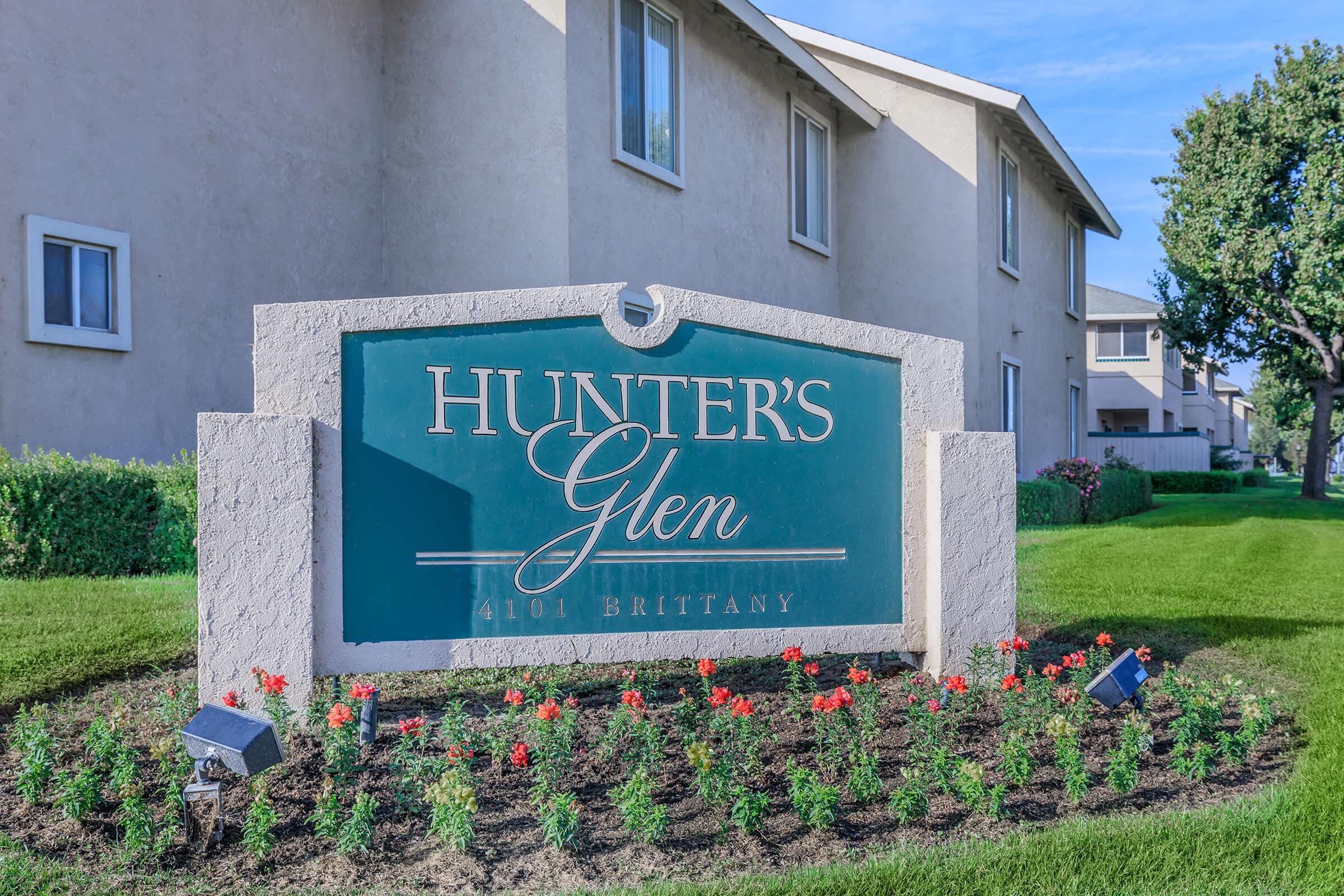 a sign in front of a building