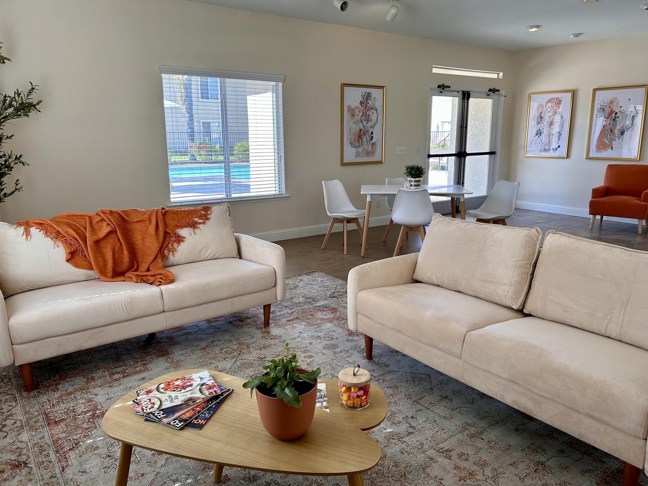 a living room filled with furniture and a flat screen tv