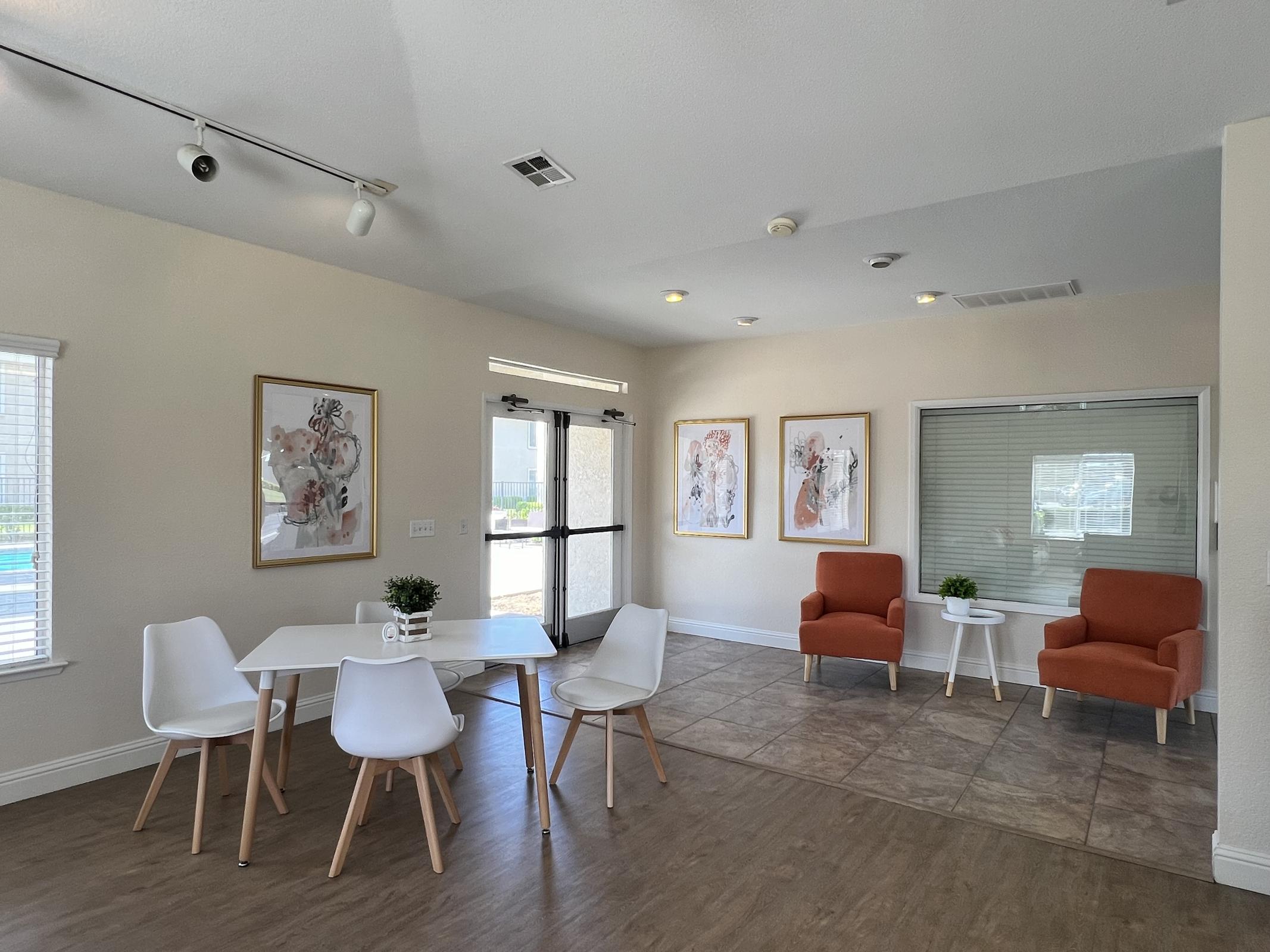 a living room filled with furniture and a large window