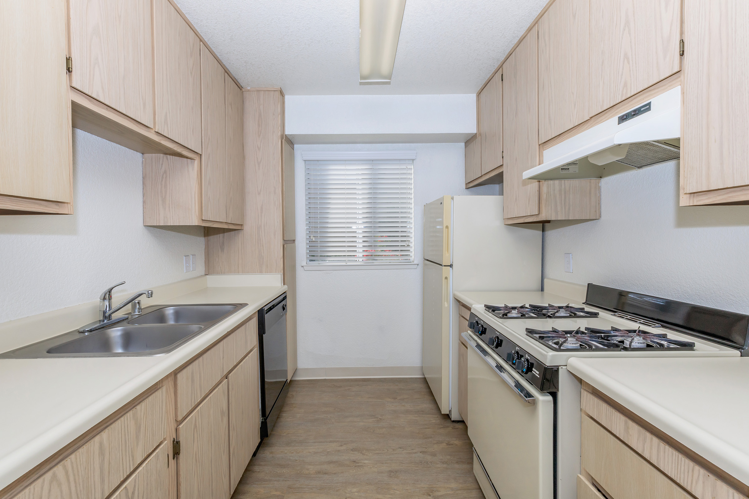 a kitchen with a stove and a sink