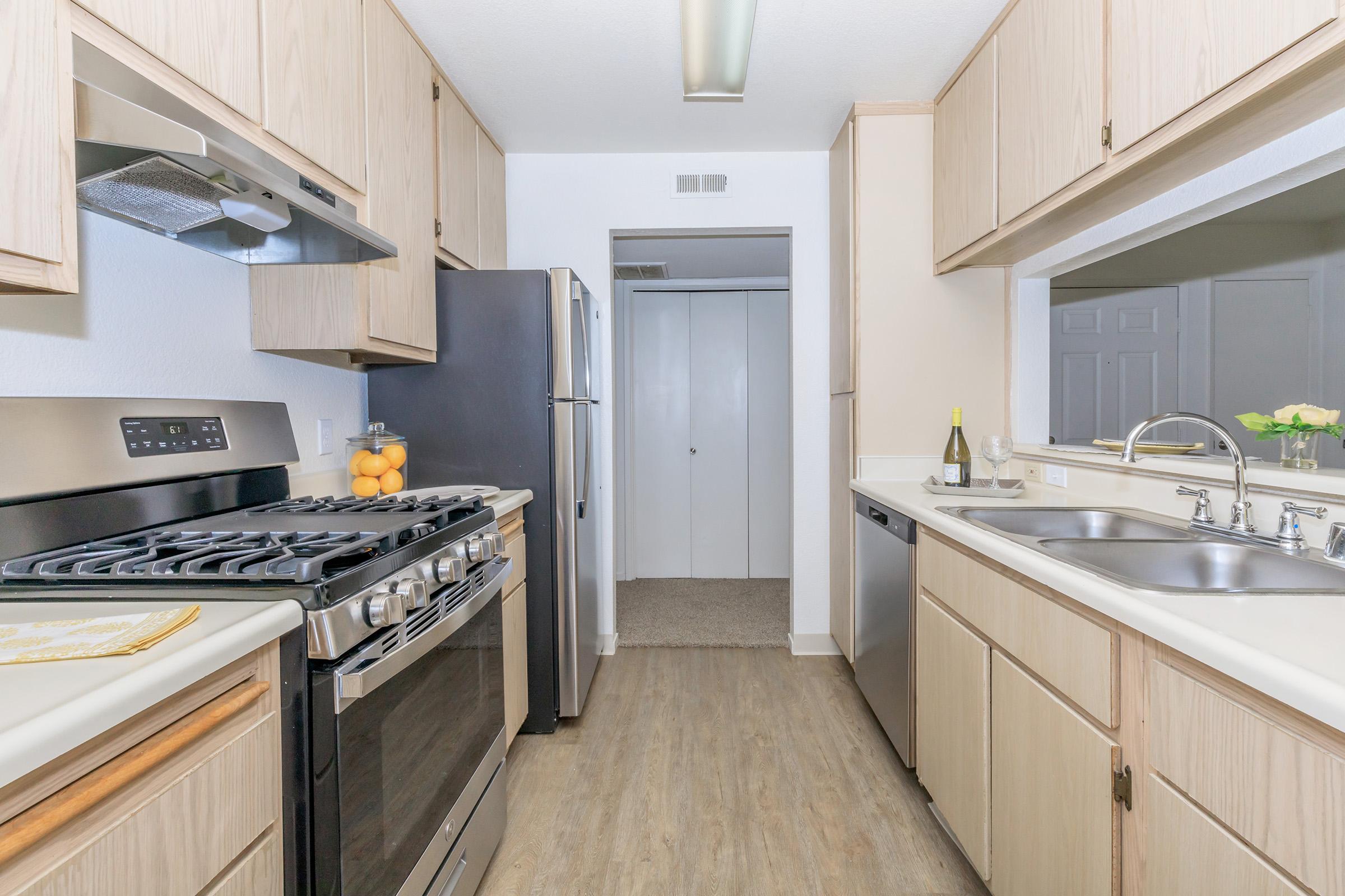 a kitchen with a stove and a sink