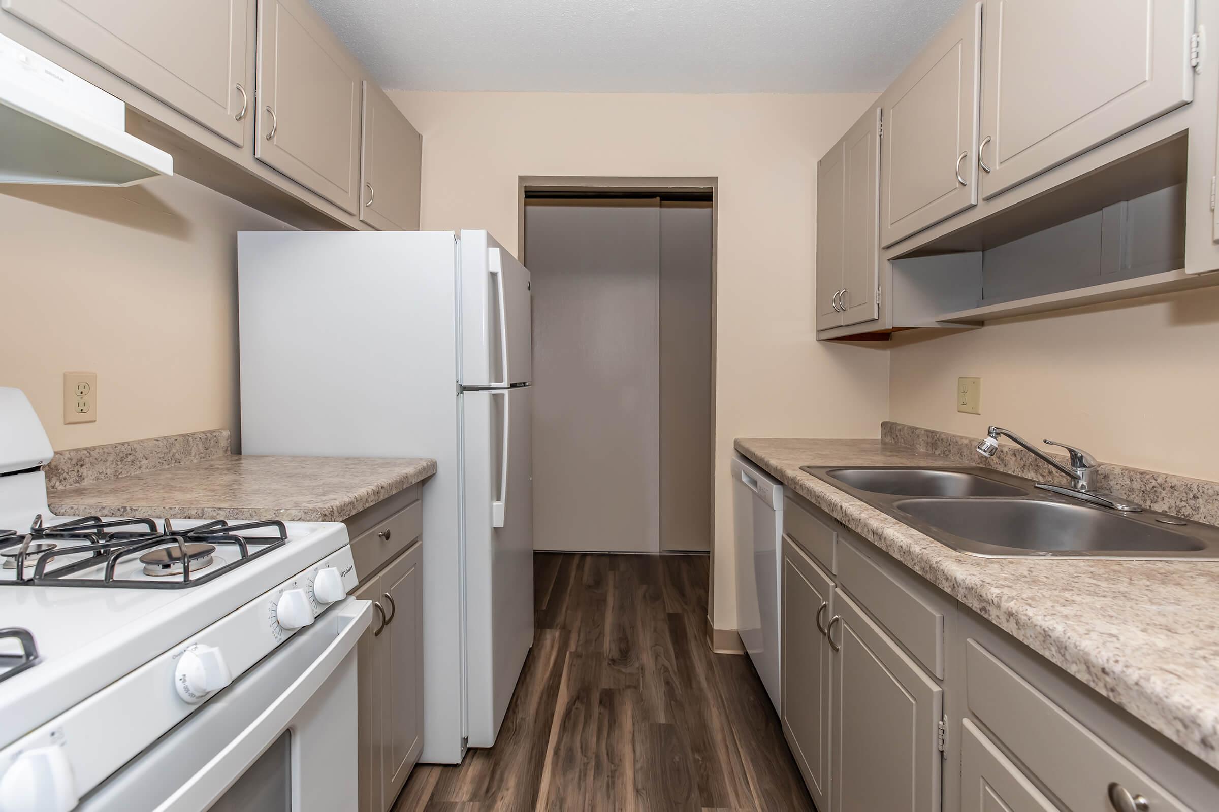 a kitchen with a stove and a sink