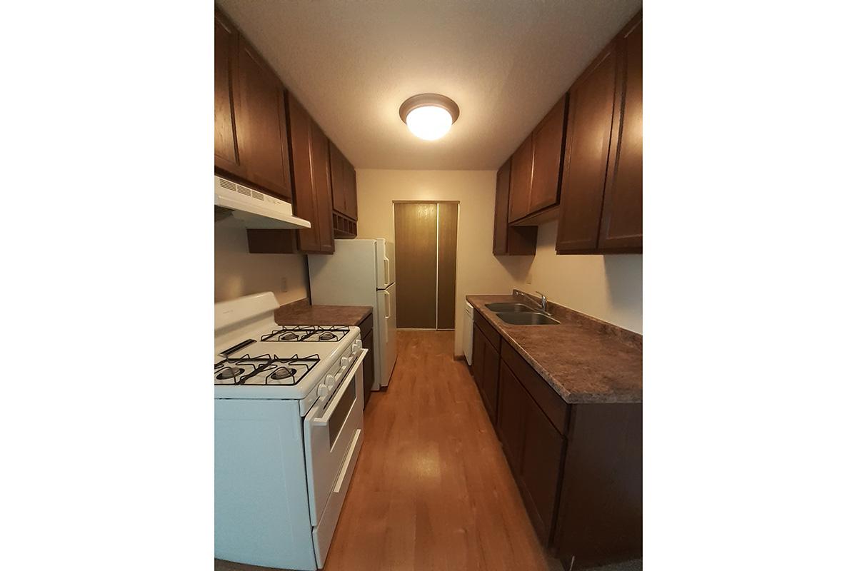 a stove top oven sitting inside of a kitchen