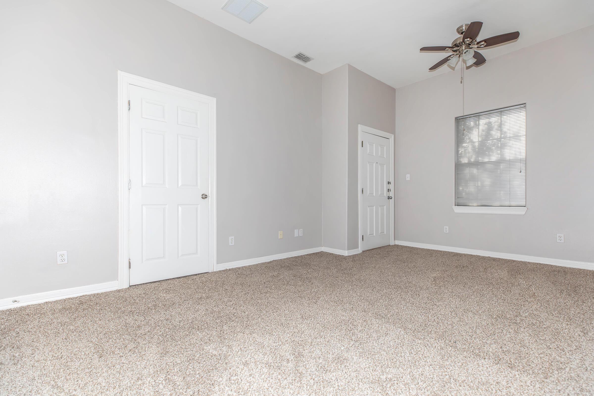 a bedroom with a large window