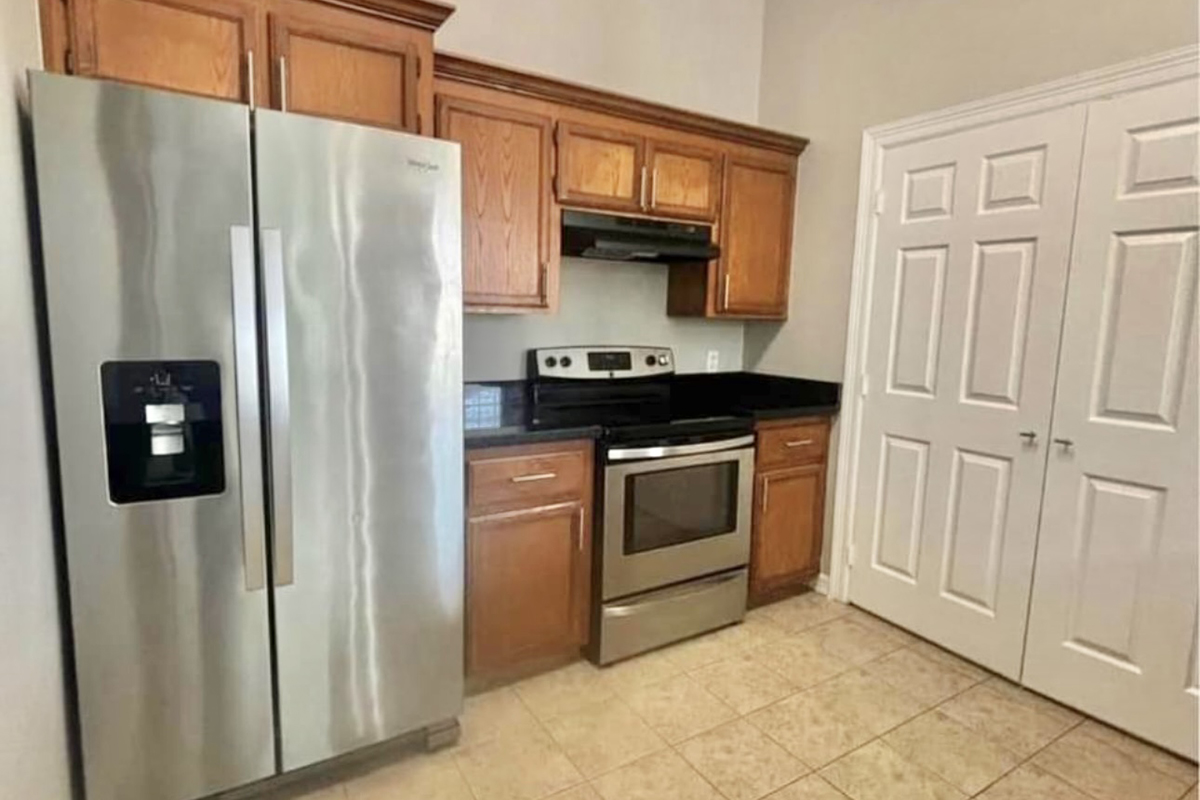 a stainless steel refrigerator in a kitchen