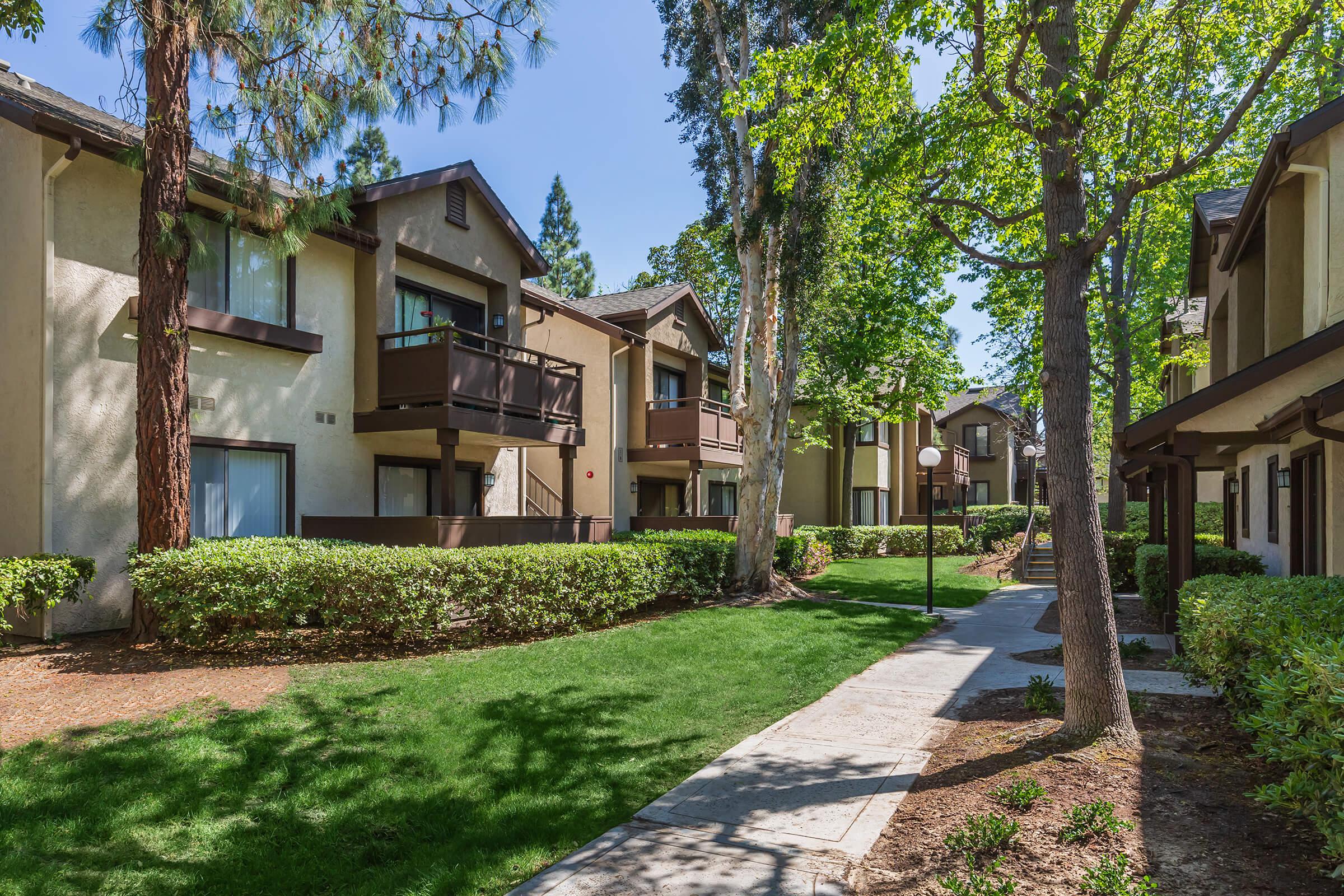 Emerald Court Apartment Homes community buildings with sidewalk lamps