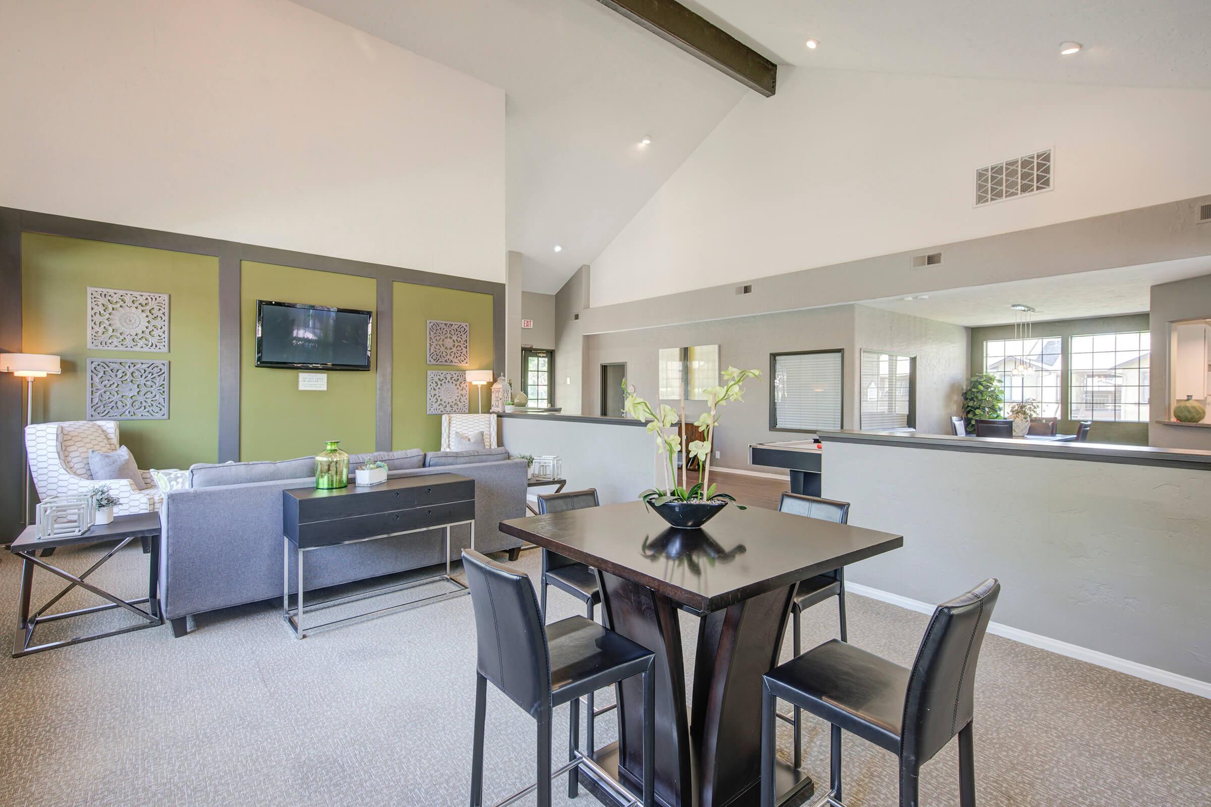 a living room filled with furniture and a table