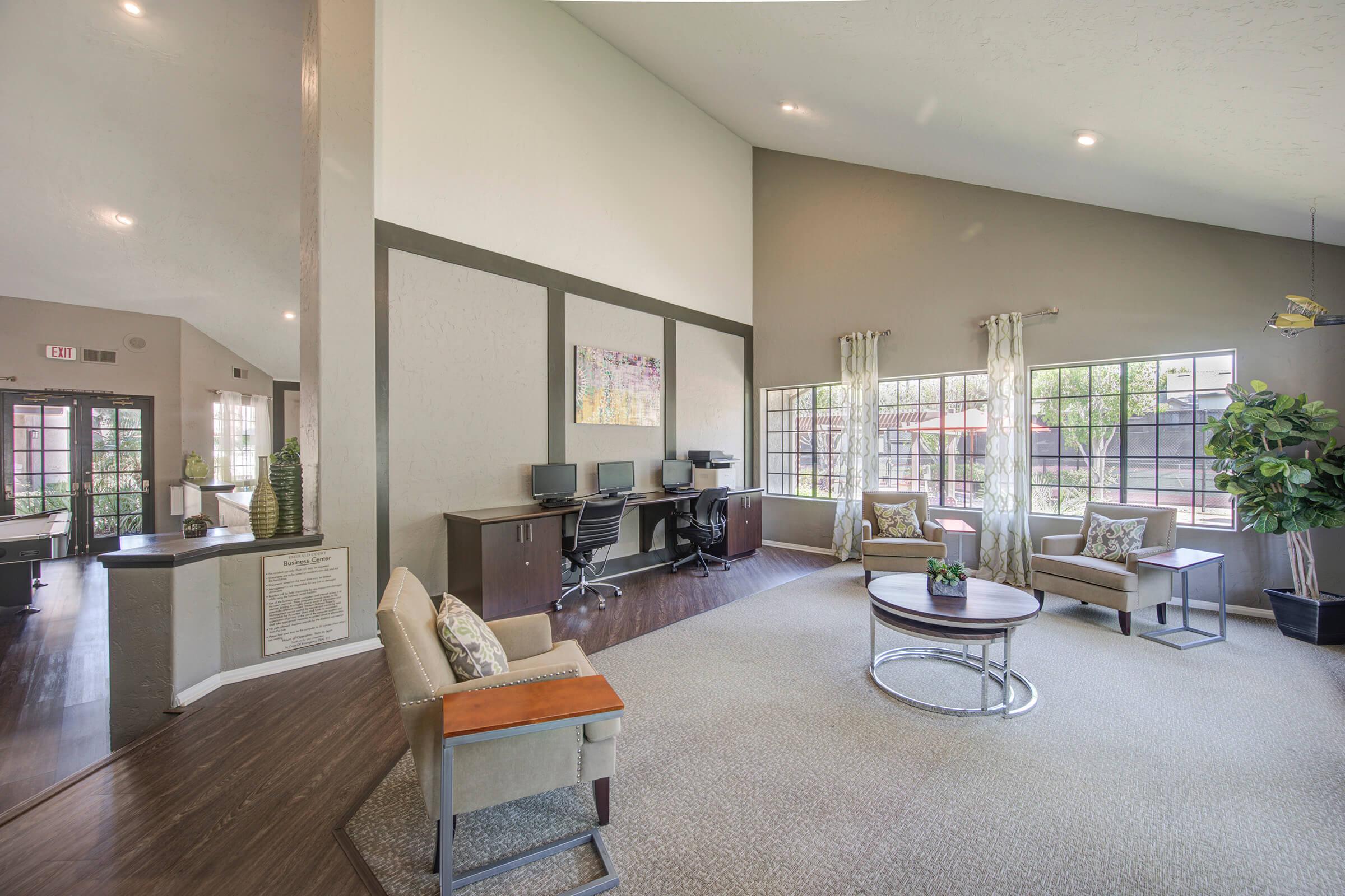 a room filled with furniture and a large window