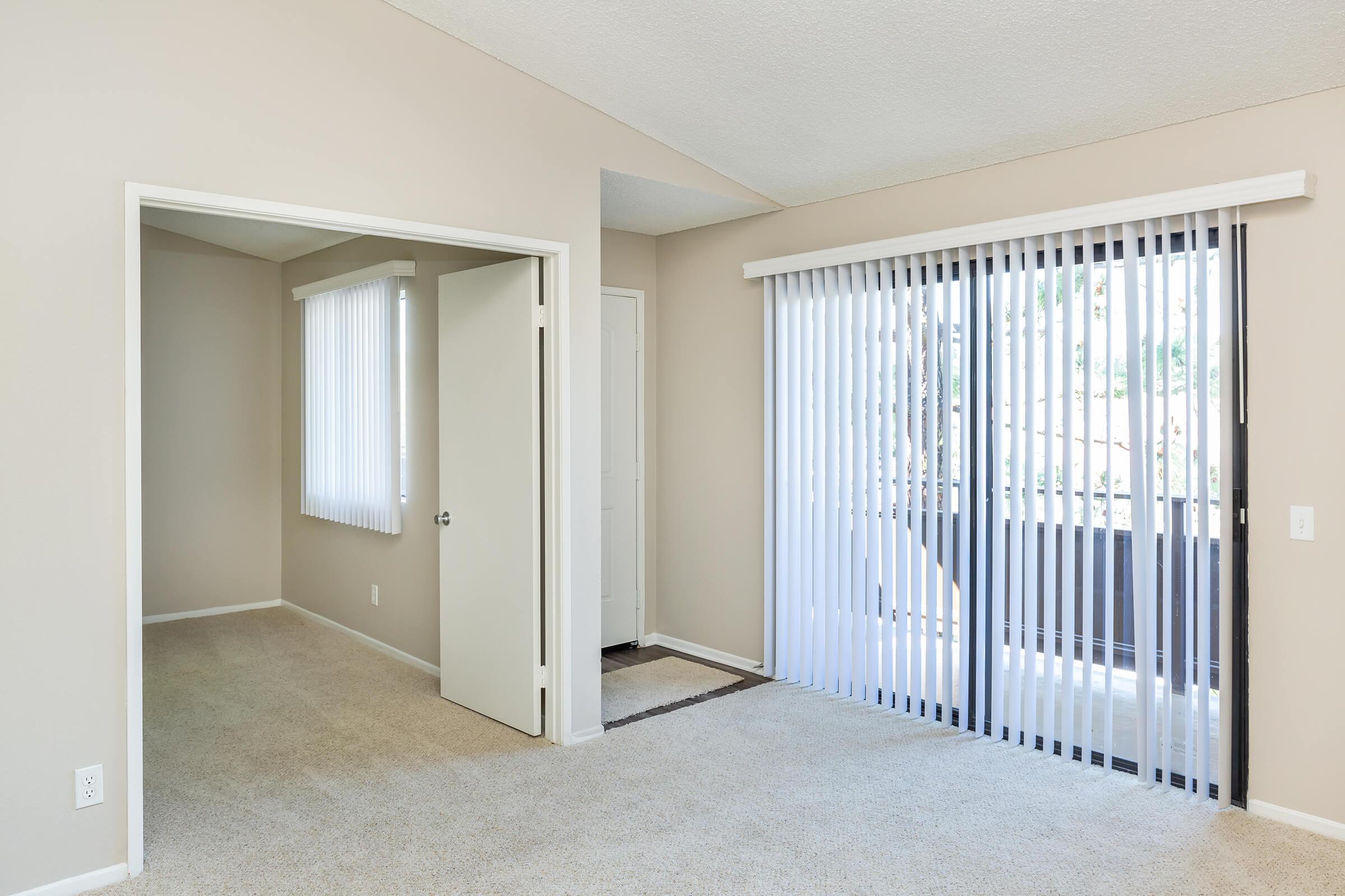 Carpeted living room and bedroom