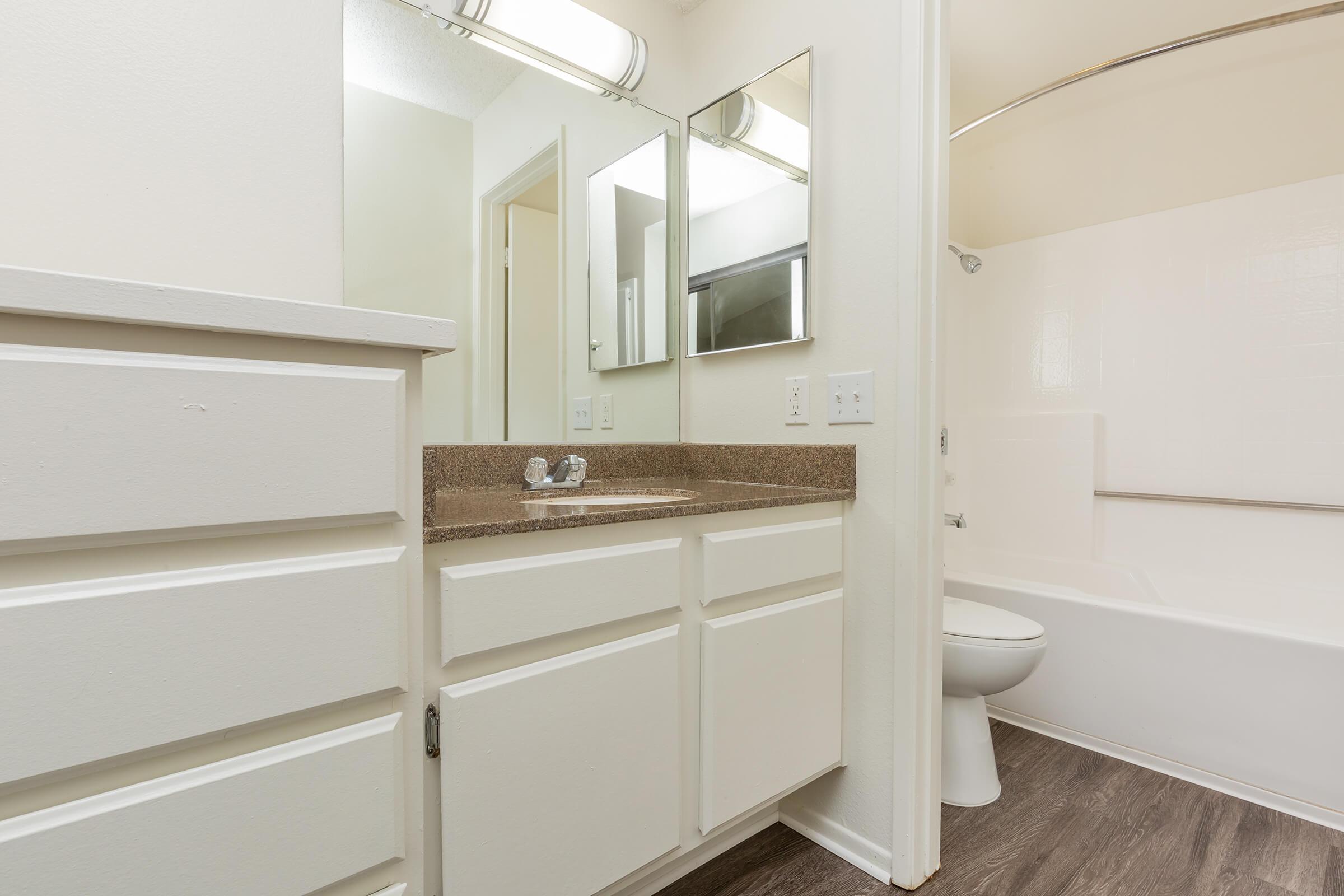 Bathroom sink with white cabinets