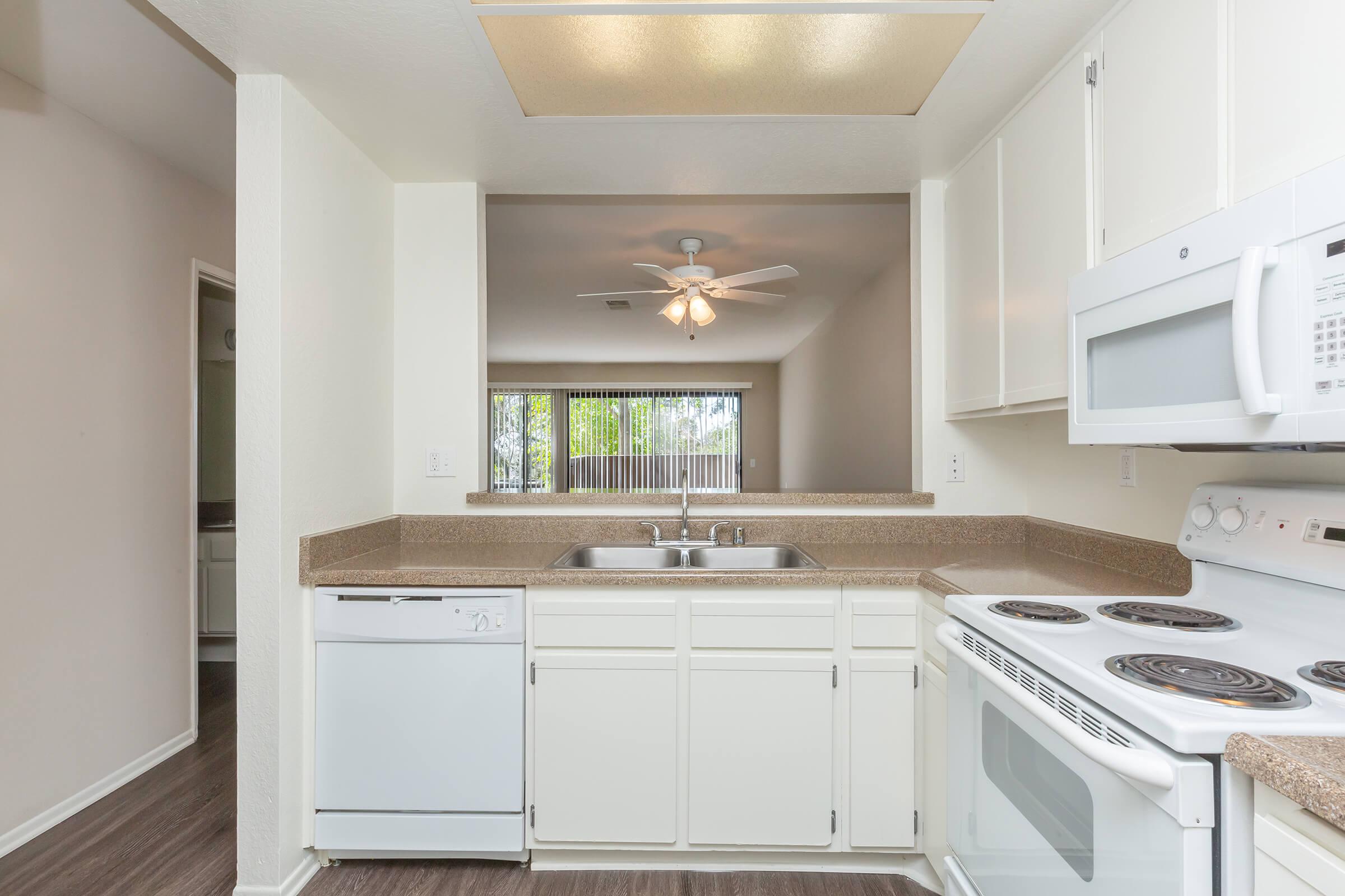 Unfurnished kitchen with wooden floors