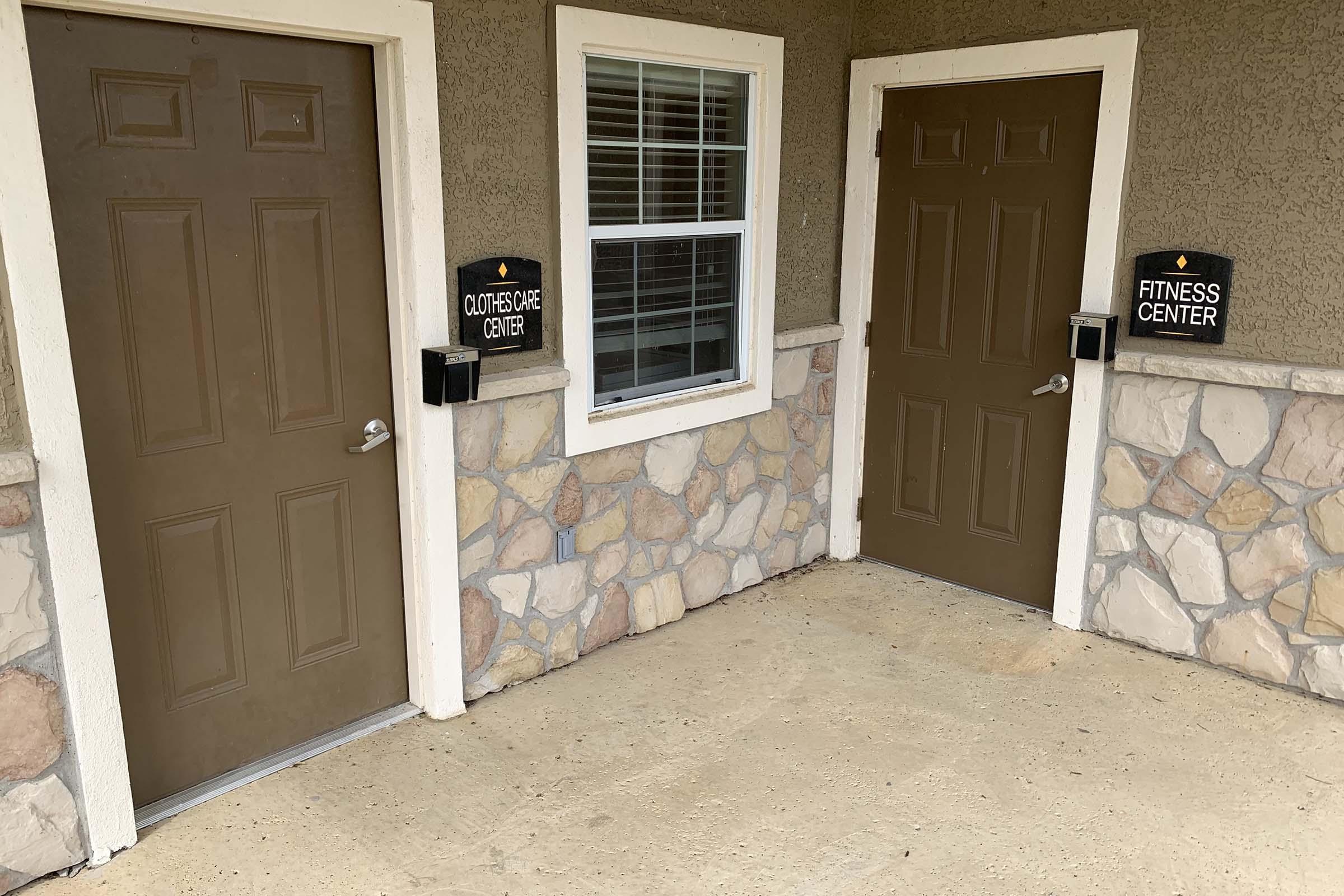 a door is open to a brick building