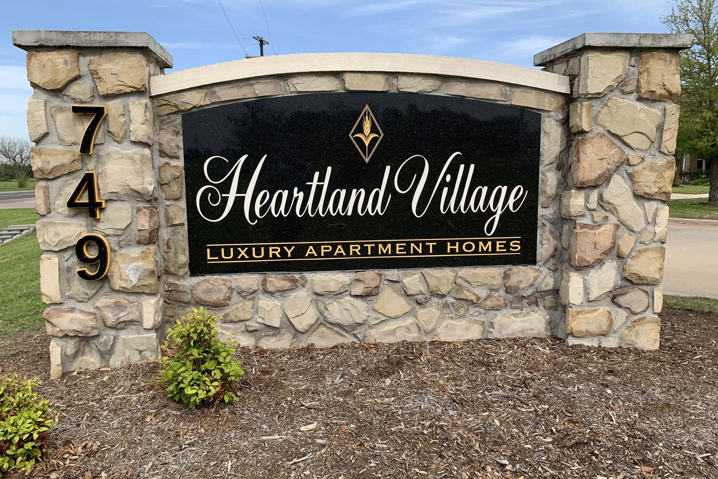 a stone building that has a sign on a brick wall