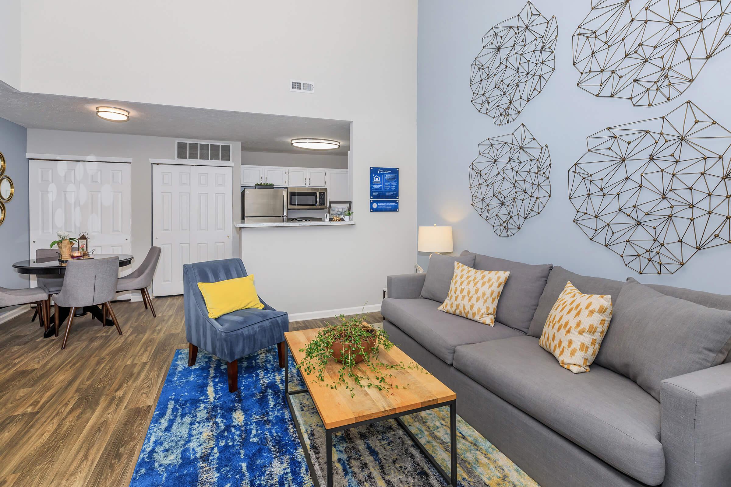 a living room filled with furniture and a rug