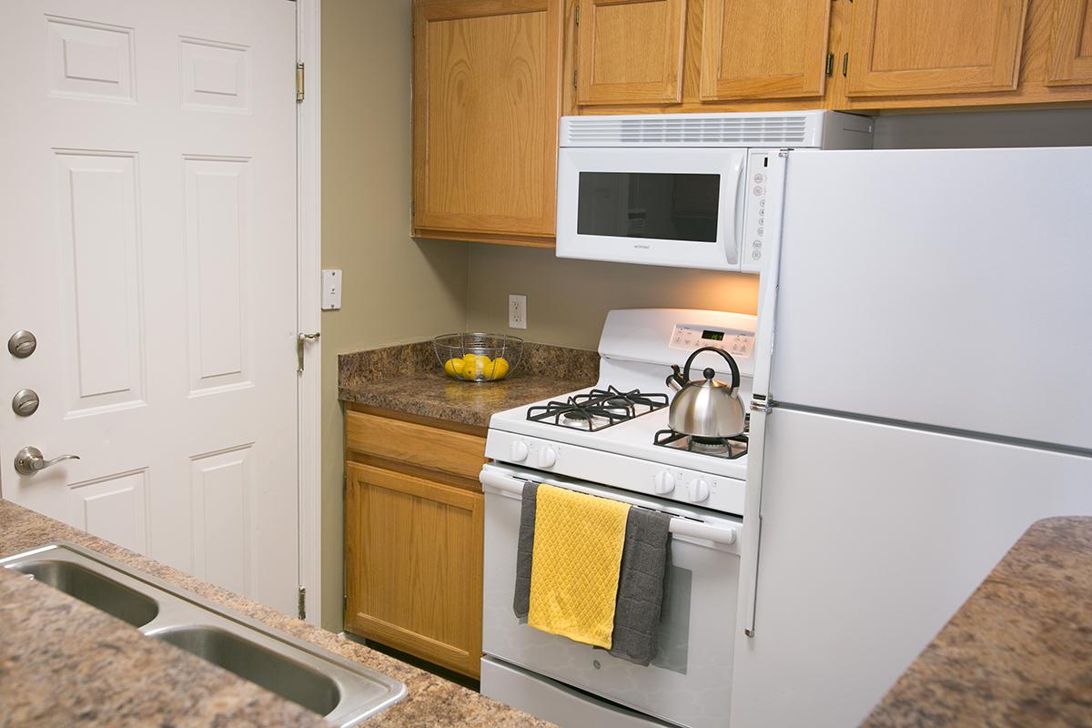 a kitchen with a stove top oven sitting inside of a refrigerator