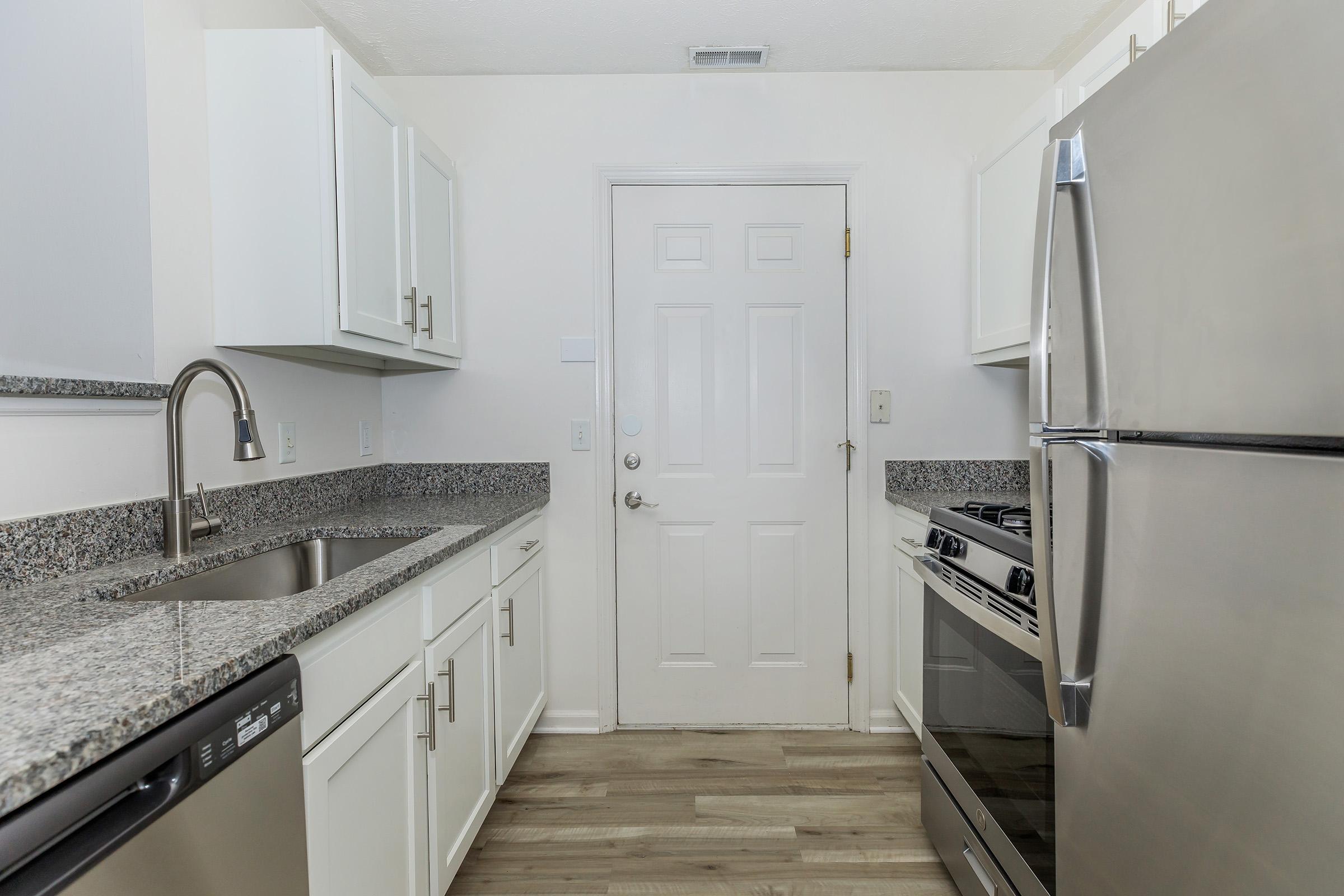 a stainless steel refrigerator in a kitchen