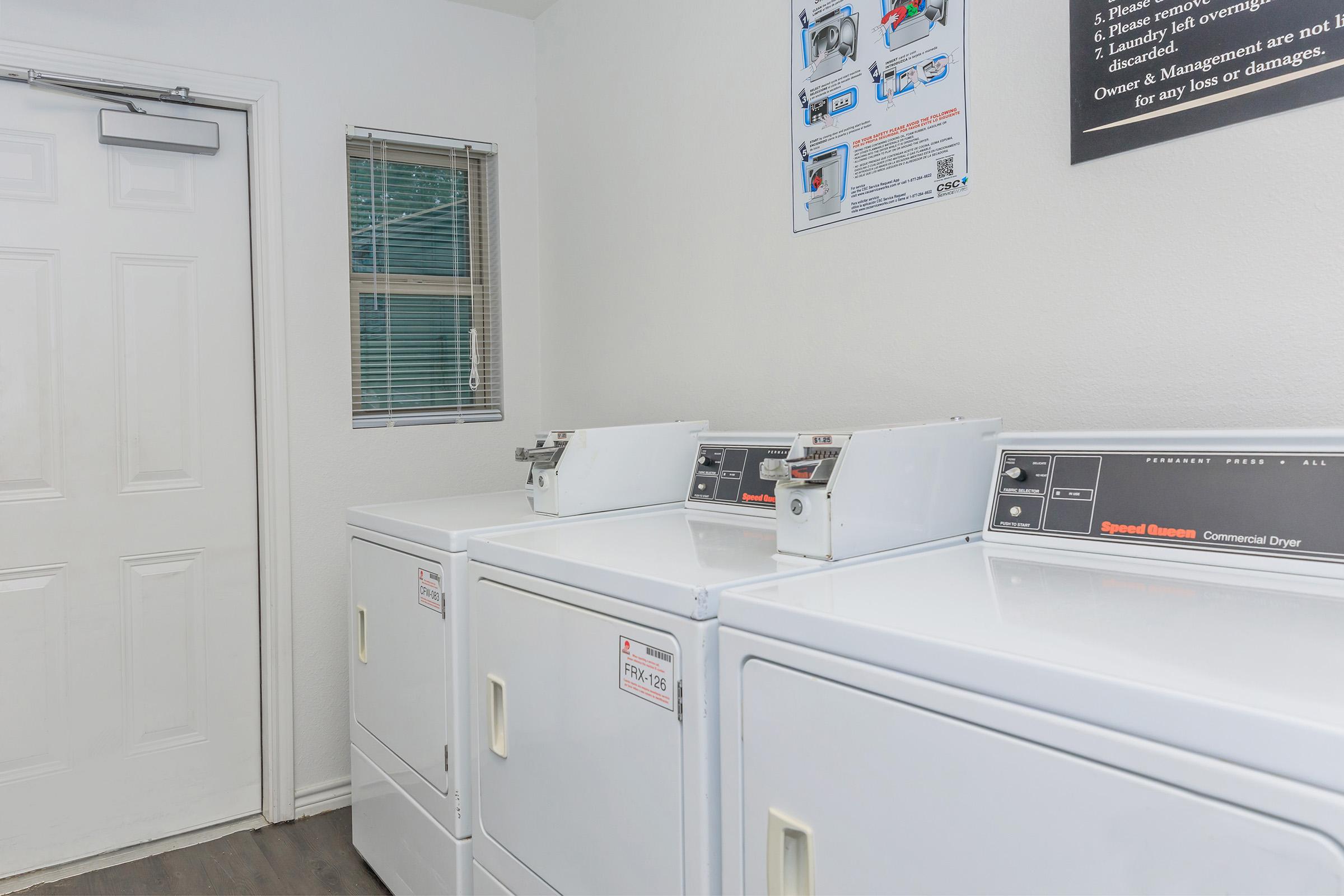 a kitchen with a sink and a refrigerator