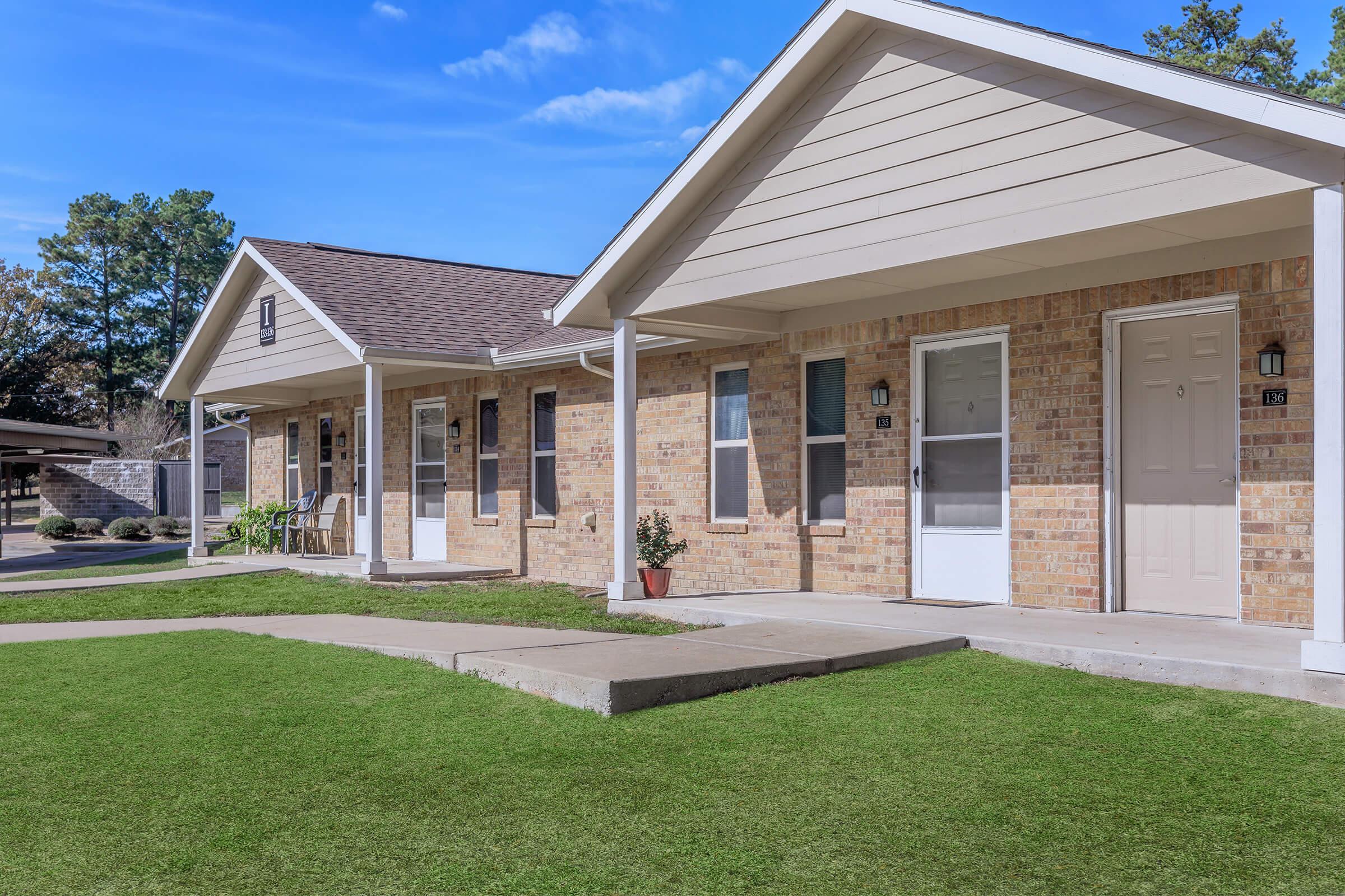 a large lawn in front of a house