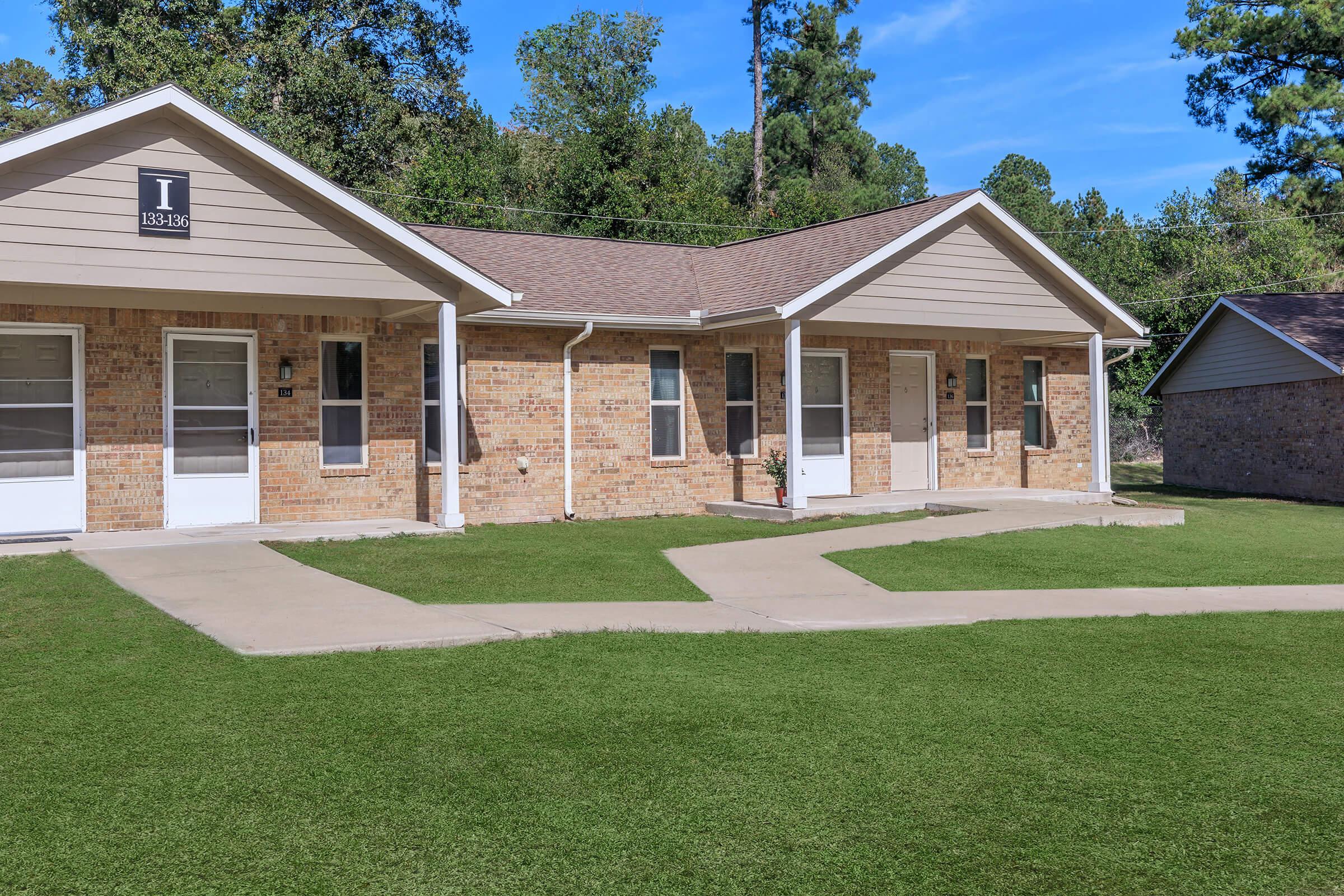 a large lawn in front of a house