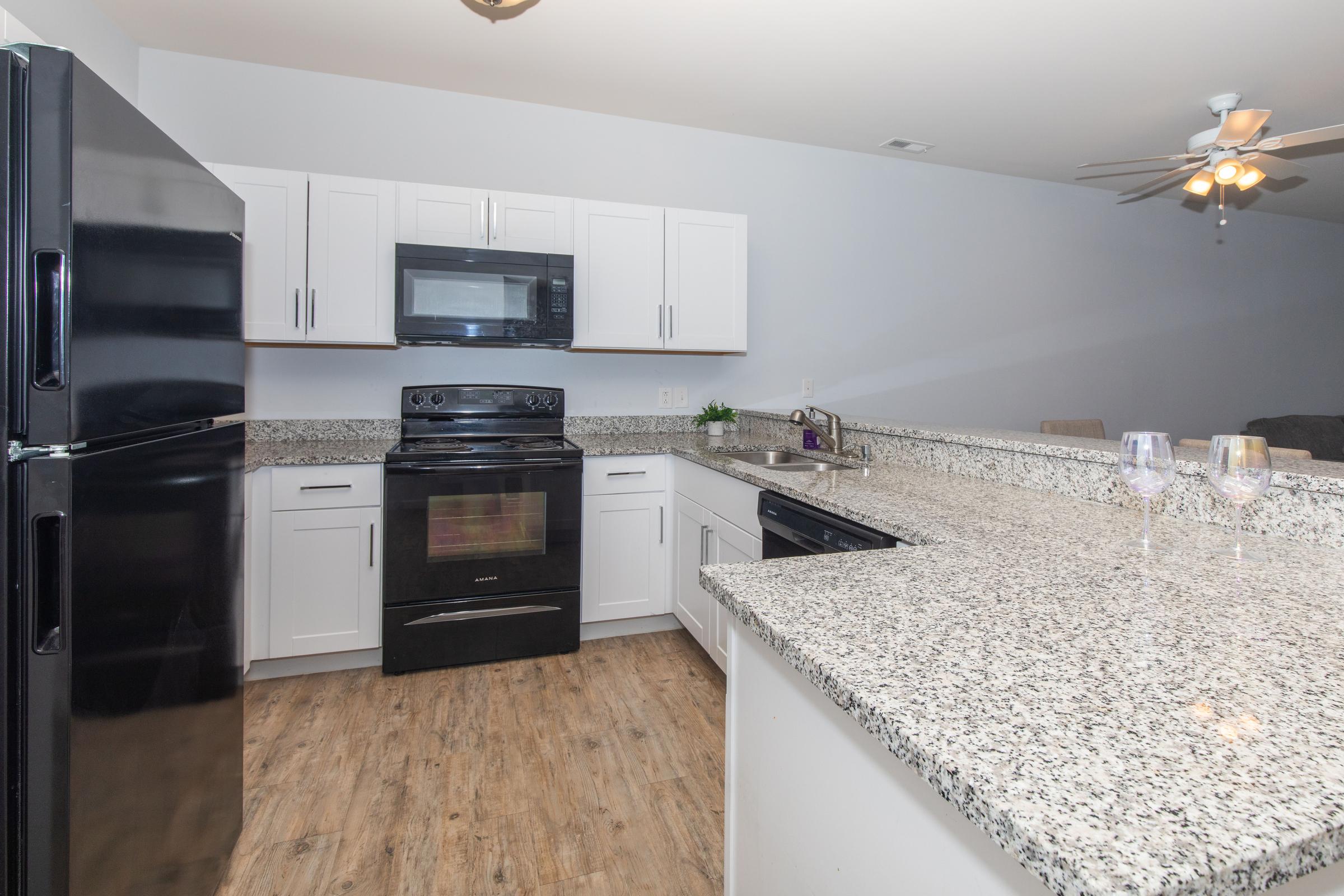 a large kitchen with stainless steel appliances