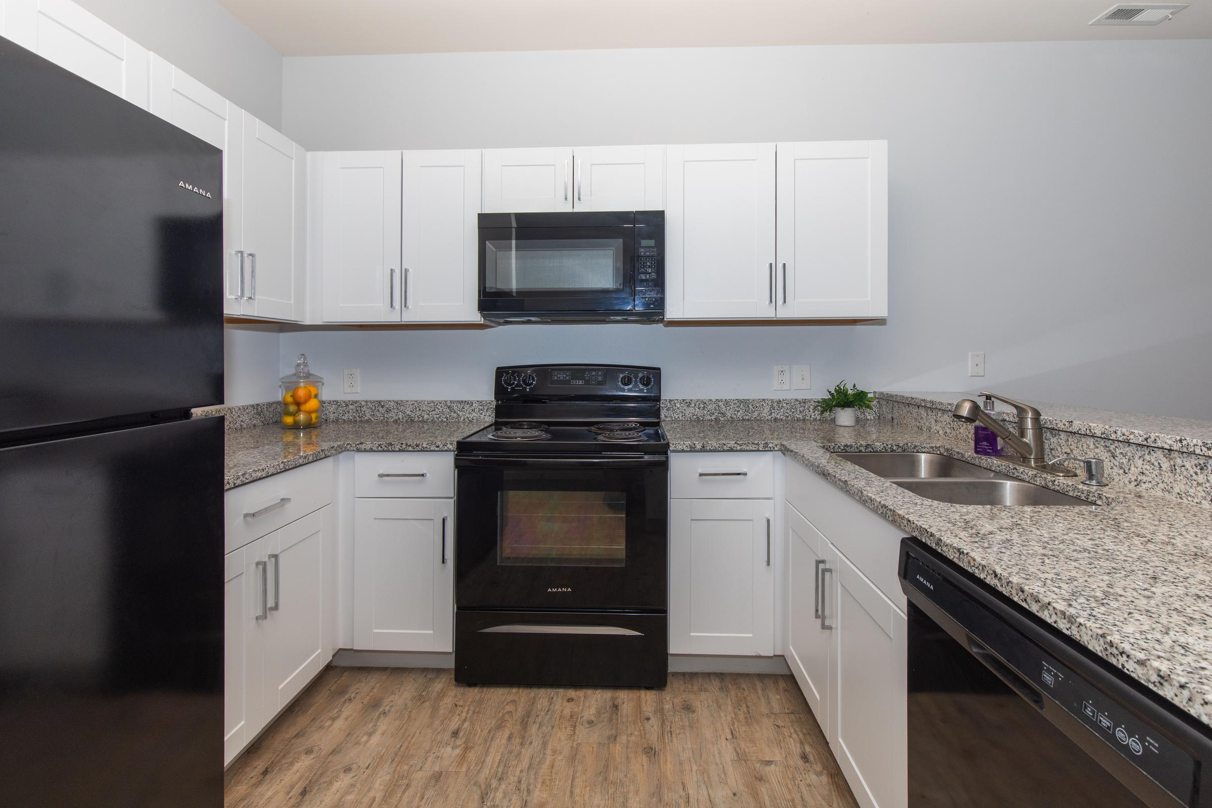 a kitchen with a stove and a microwave