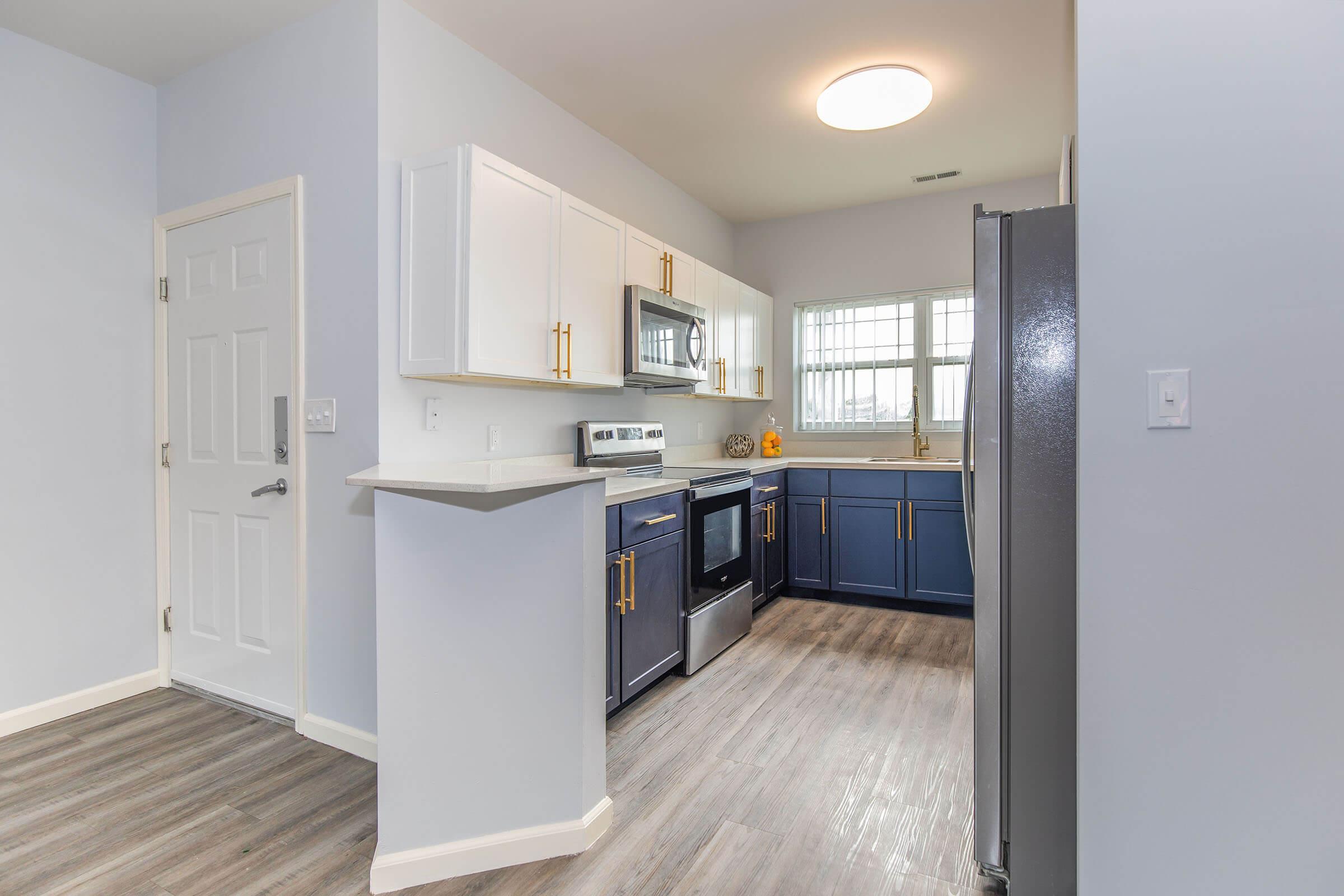 a stainless steel refrigerator in a kitchen