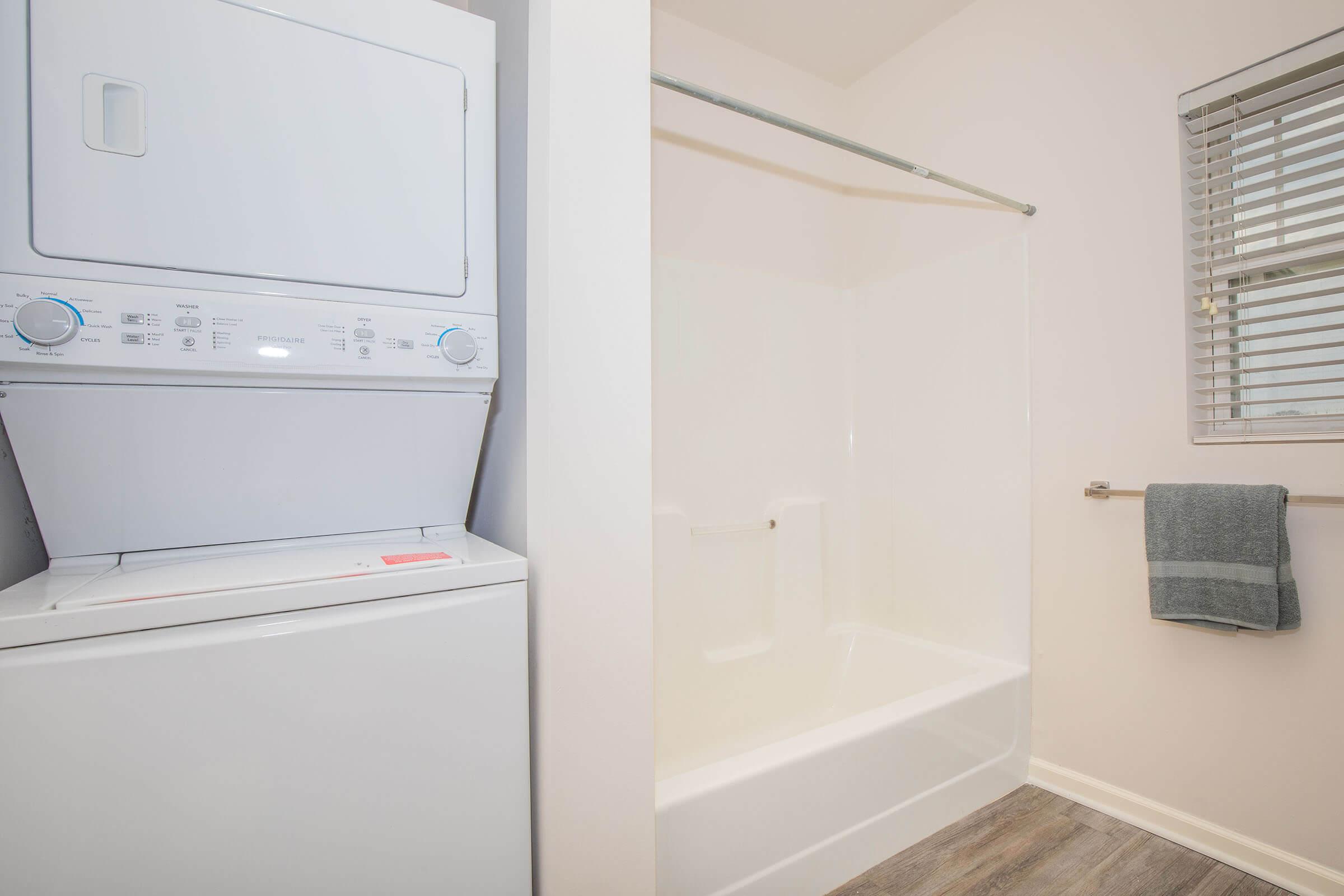 a stove top oven sitting next to a shower