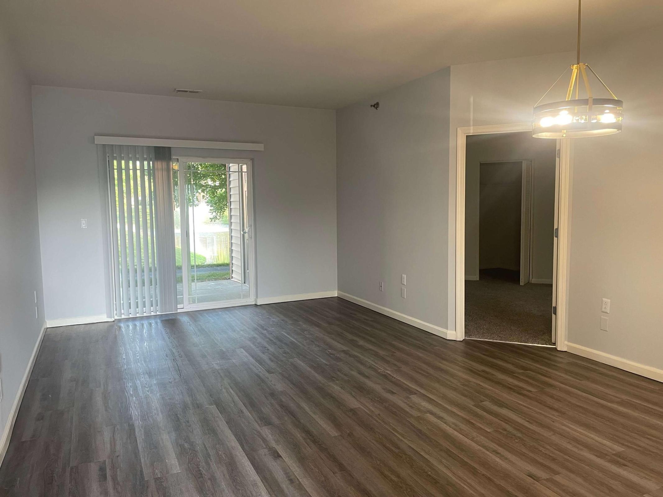 a large empty room with a wood floor