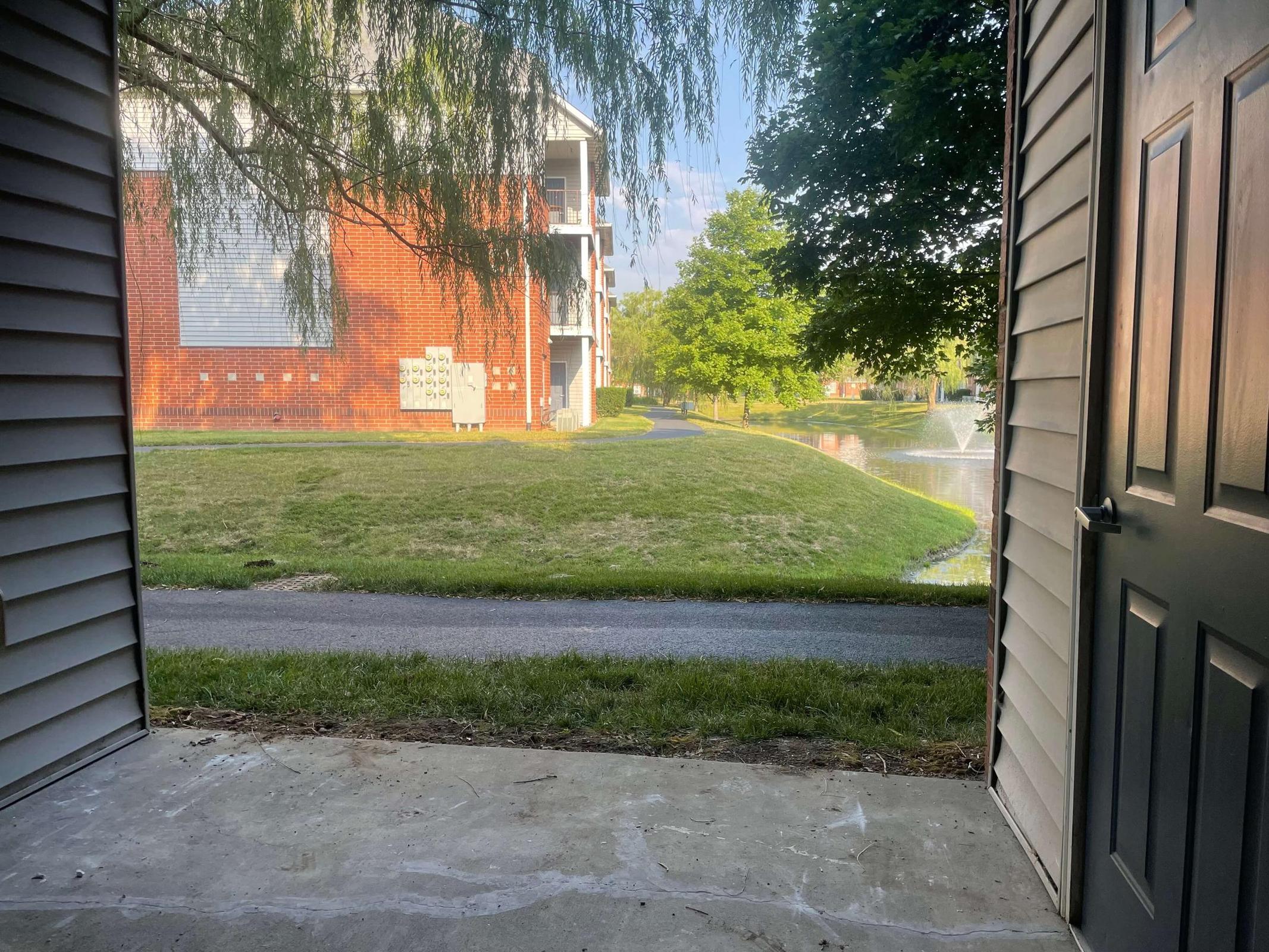 a bench in front of a brick building