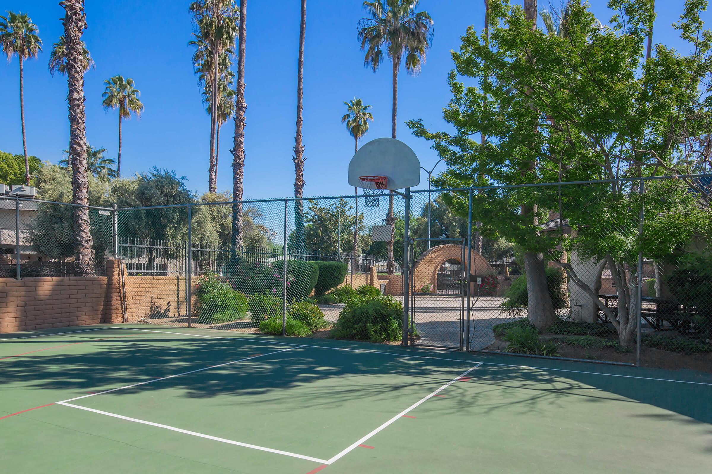 a basketball on a court with a racket
