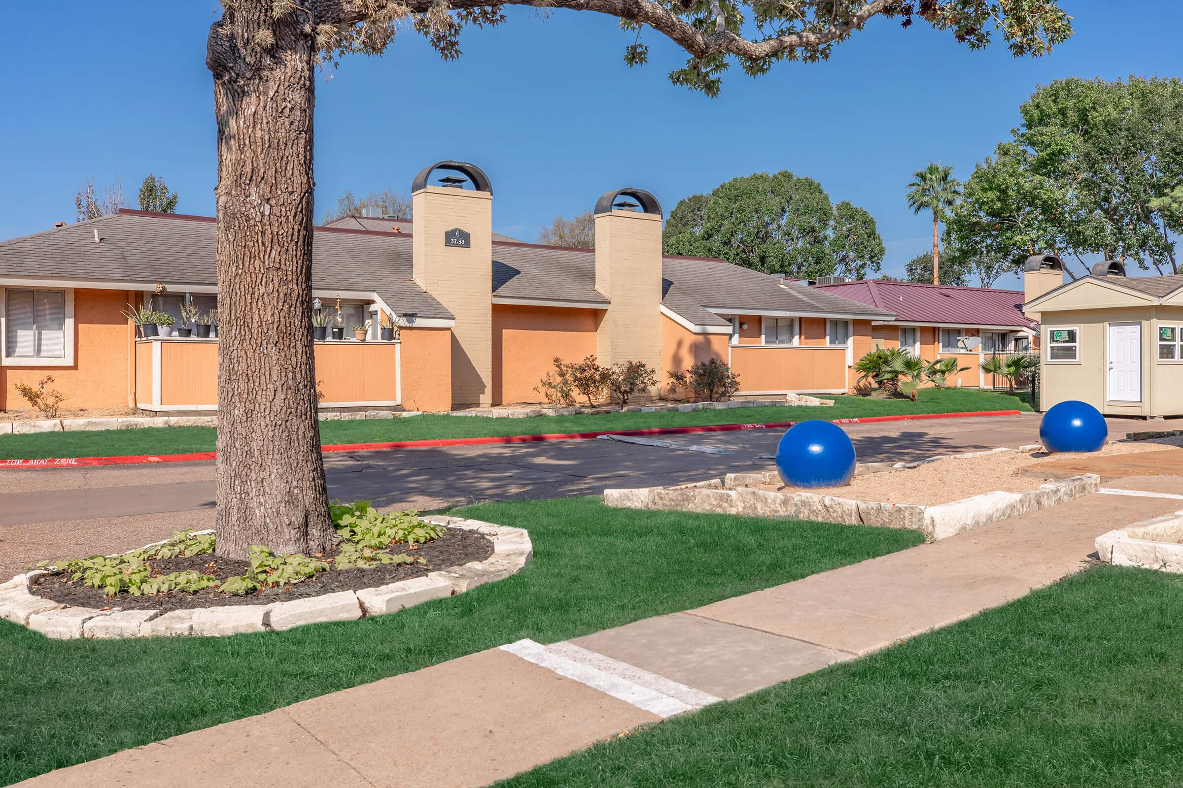 a large lawn in front of a building